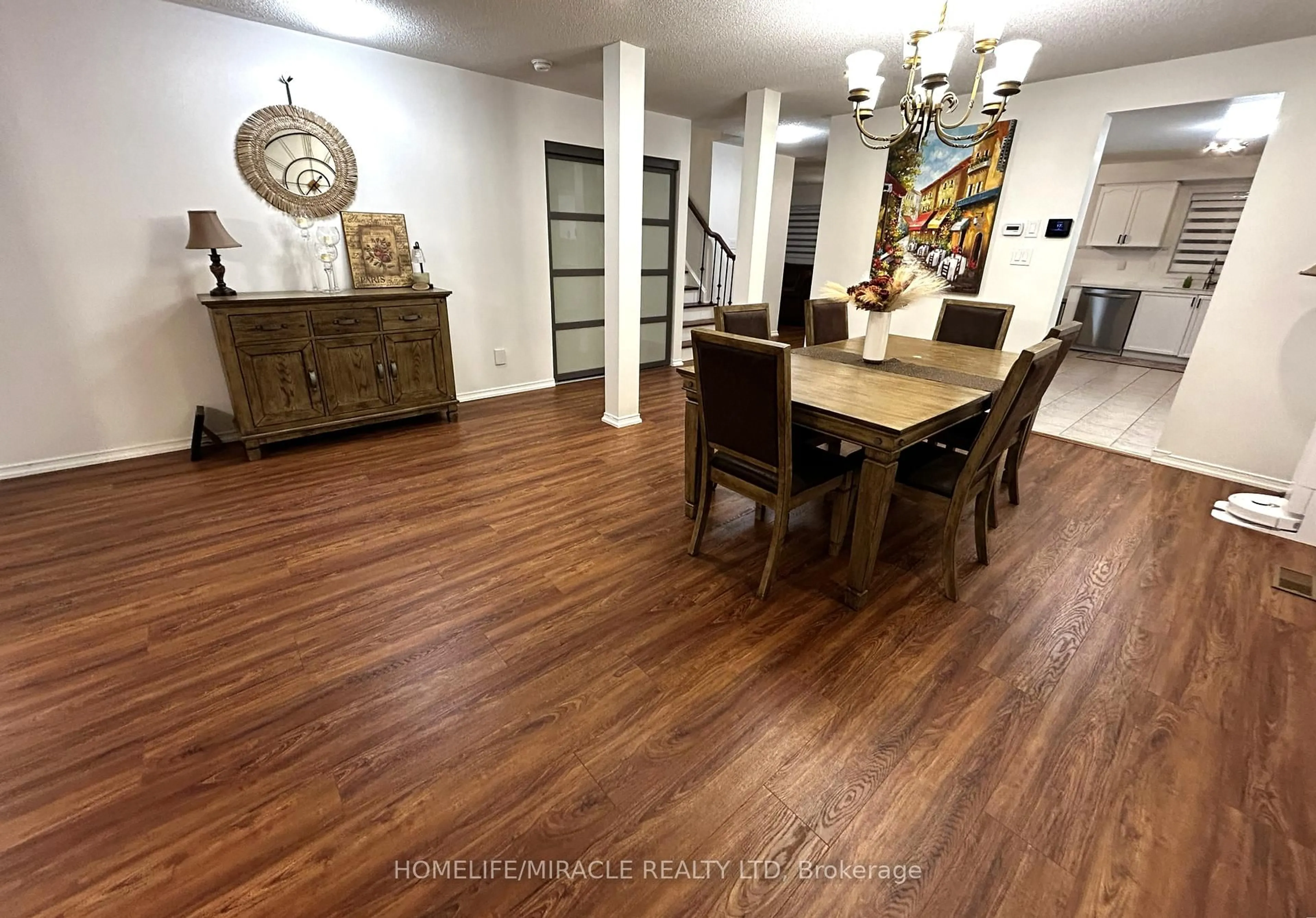 Dining room, wood/laminate floor for 65 Fairhill Ave, Brampton Ontario L7A 2E8