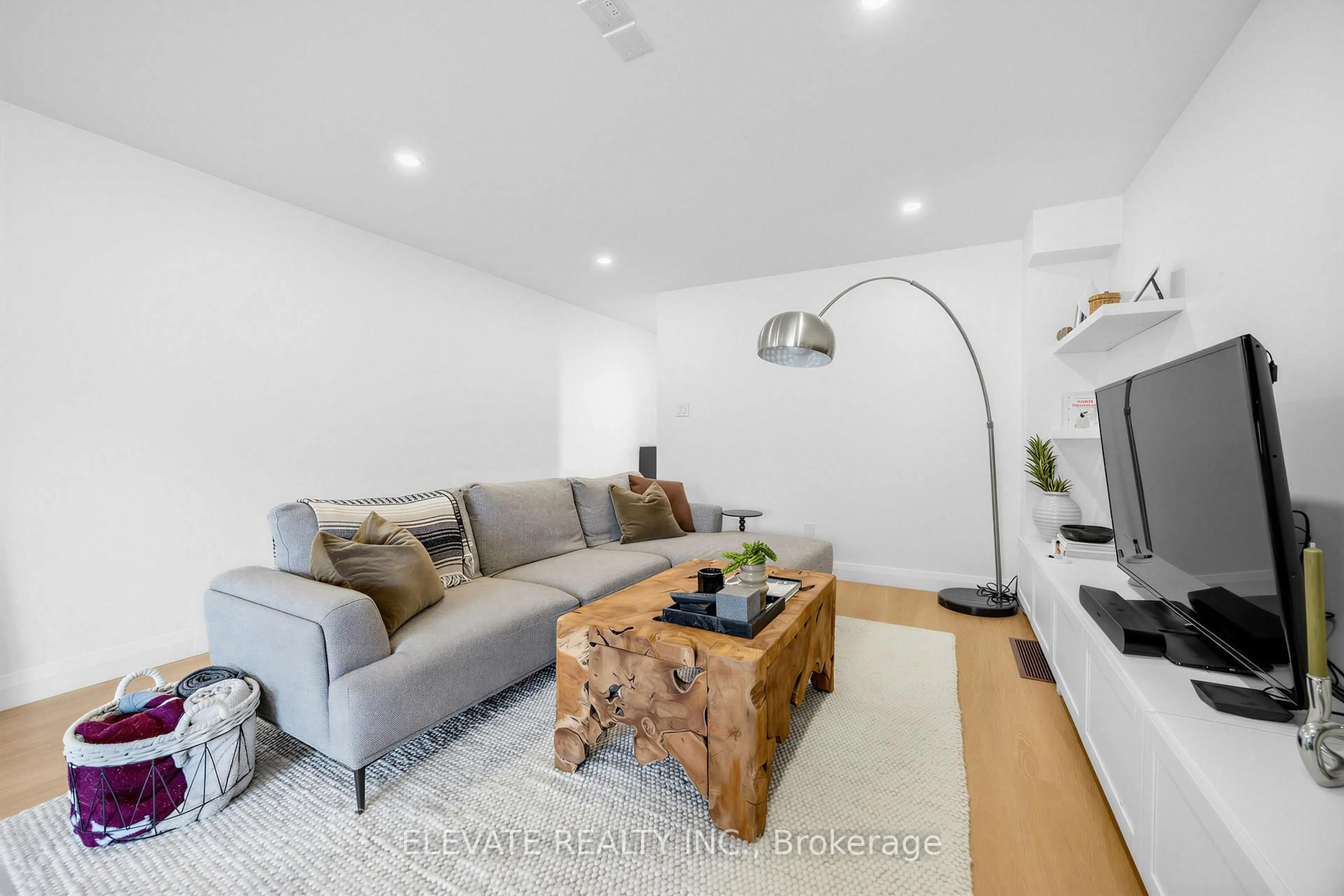 Living room with furniture, wood/laminate floor for 1 Mulock Ave, Toronto Ontario M6N 3C3