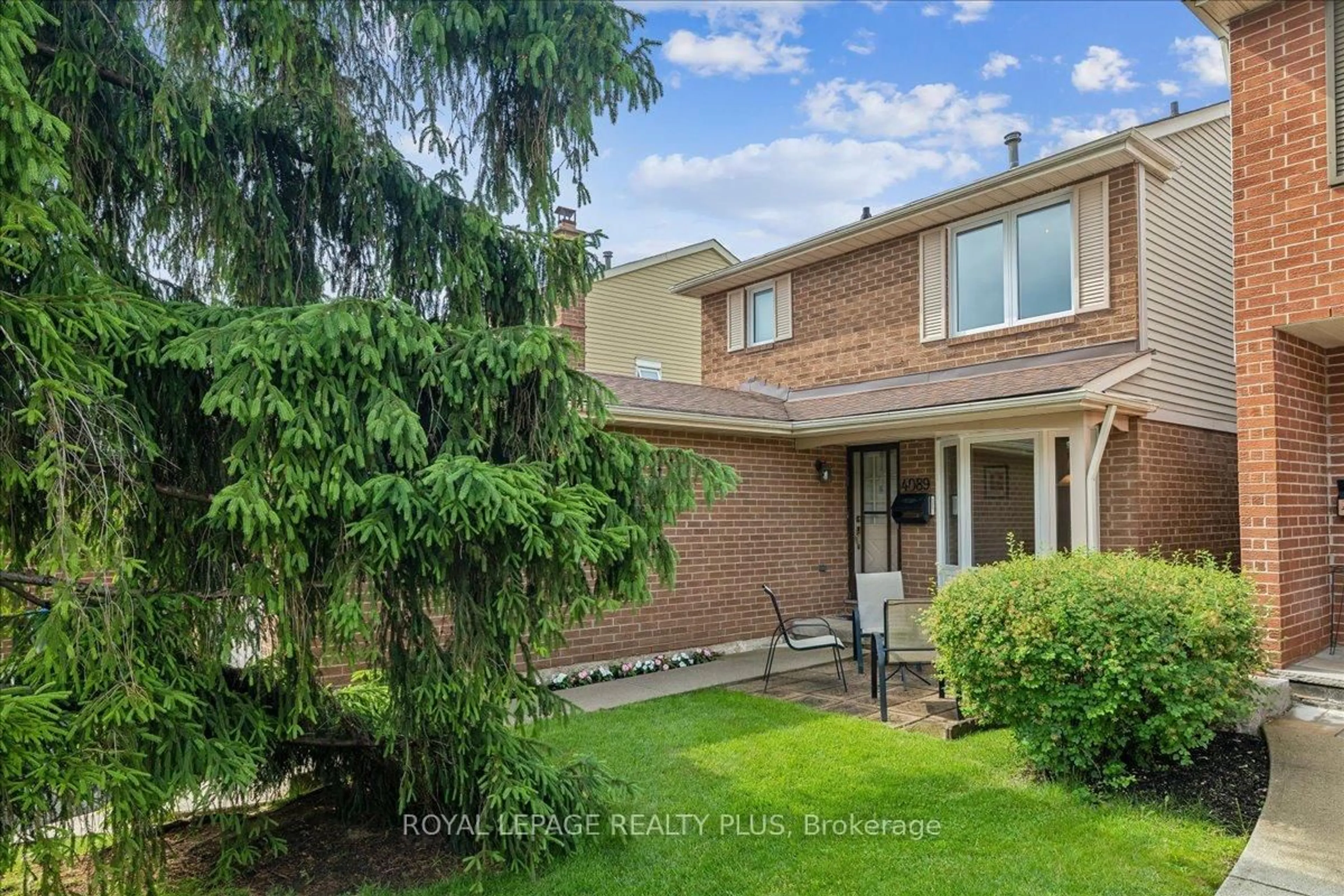 Home with brick exterior material, street for 4089 Stonemason Cres, Mississauga Ontario L5L 2Z6