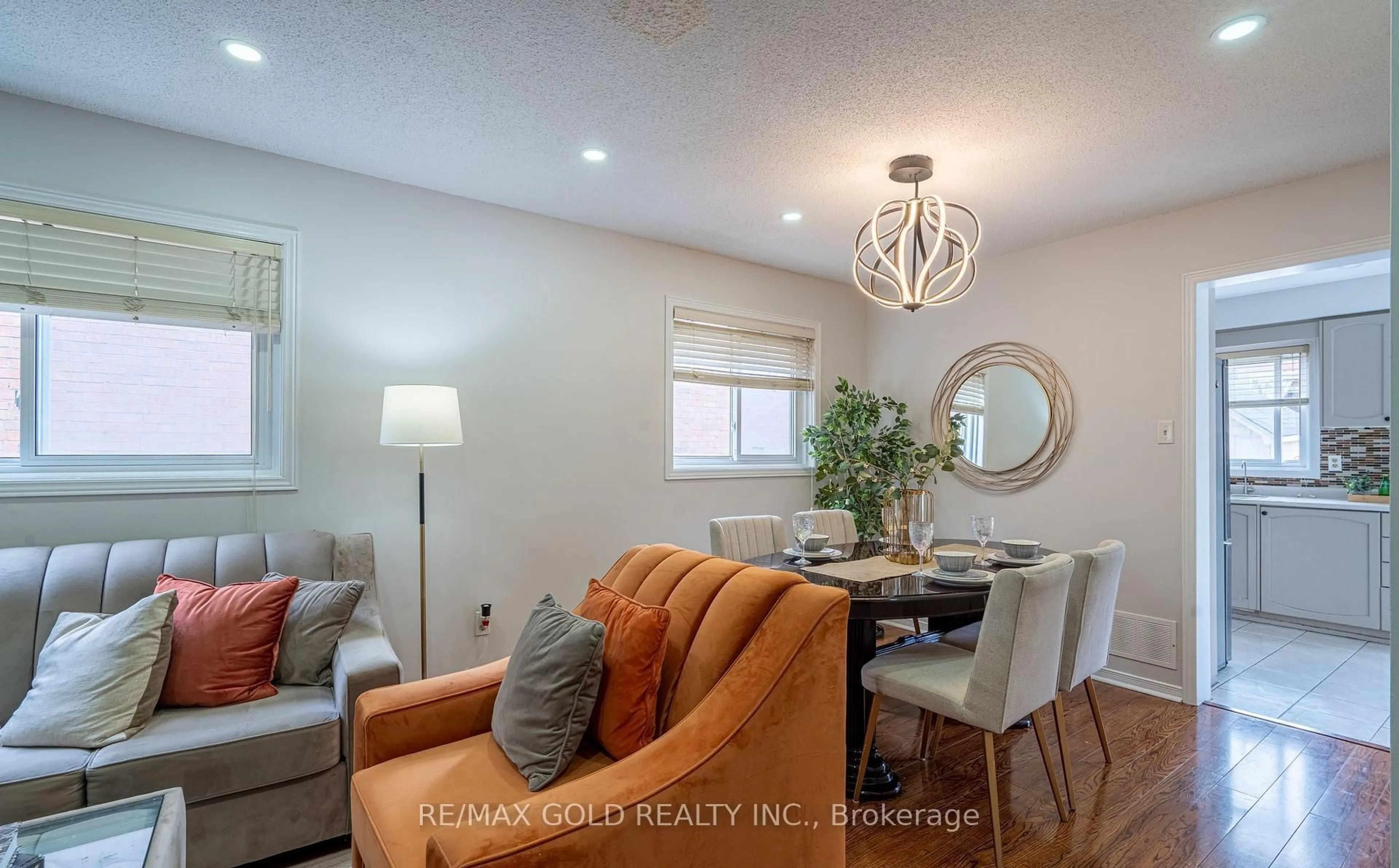 Living room with furniture, wood/laminate floor for 94 Bighorn Cres, Brampton Ontario L6R 1G7