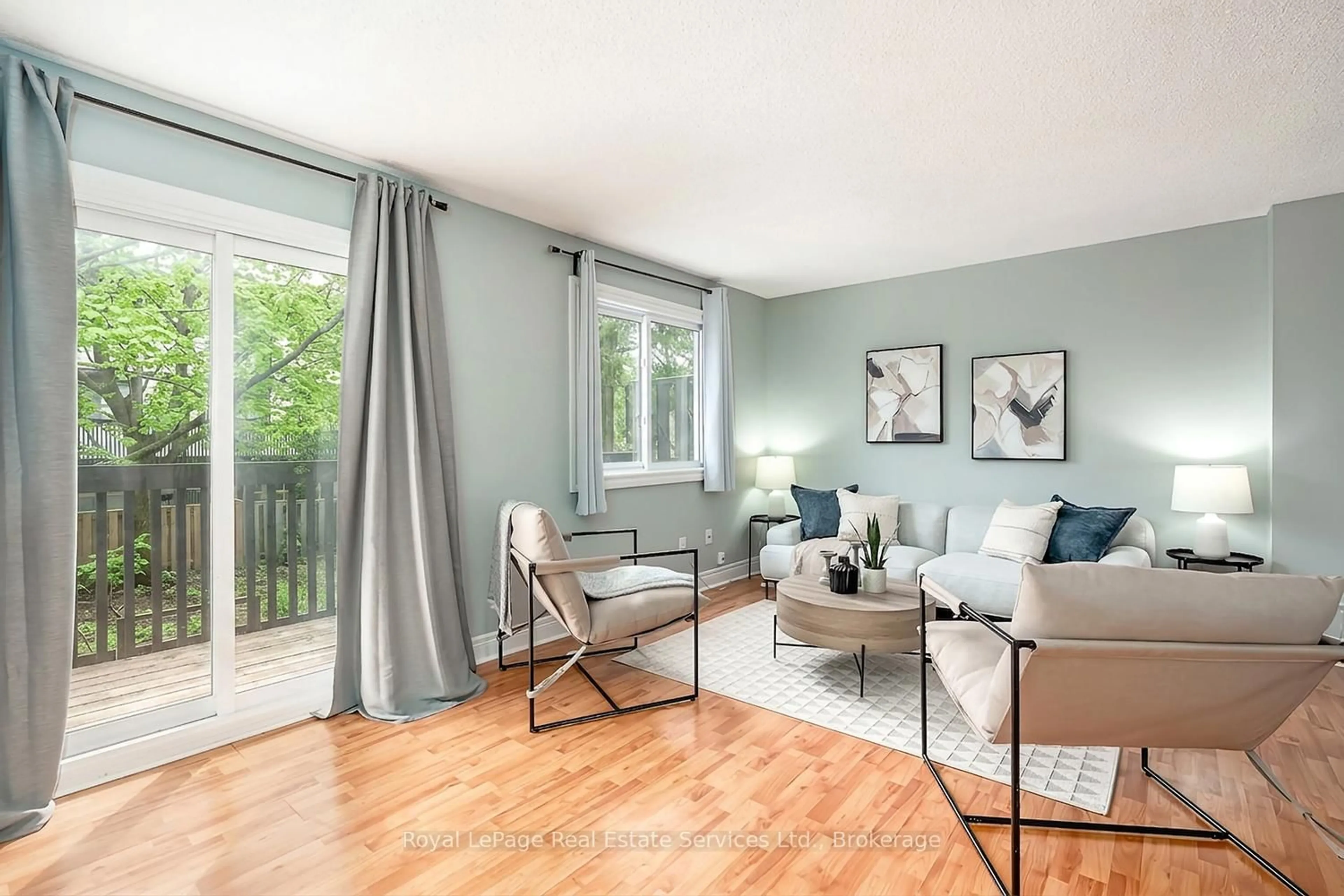 Living room with furniture, wood/laminate floor for 2651 Aquitaine Ave #24, Mississauga Ontario L5N 1V5
