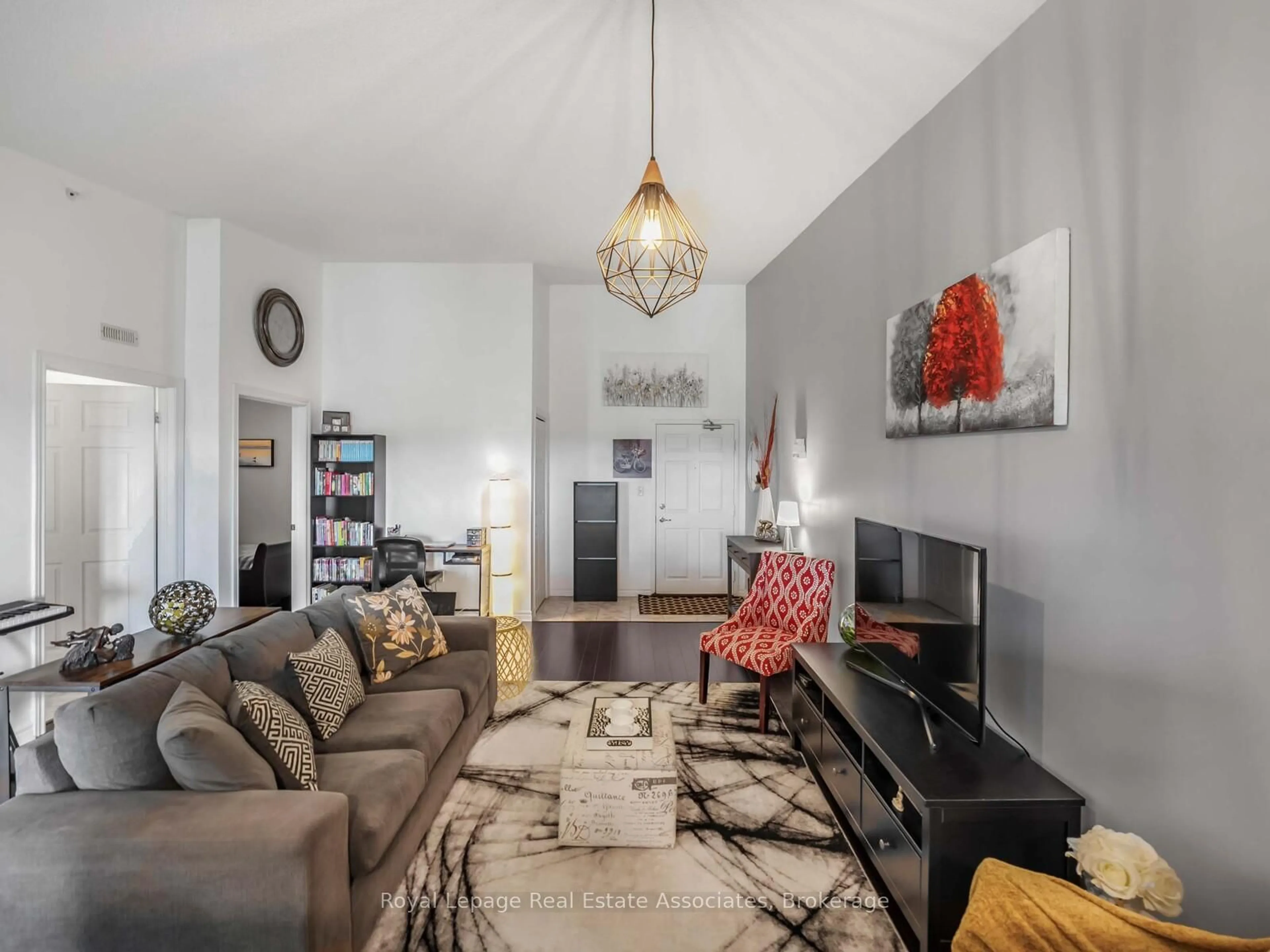 Living room with furniture, unknown for 1390 Main St #405, Milton Ontario L9T 7S9