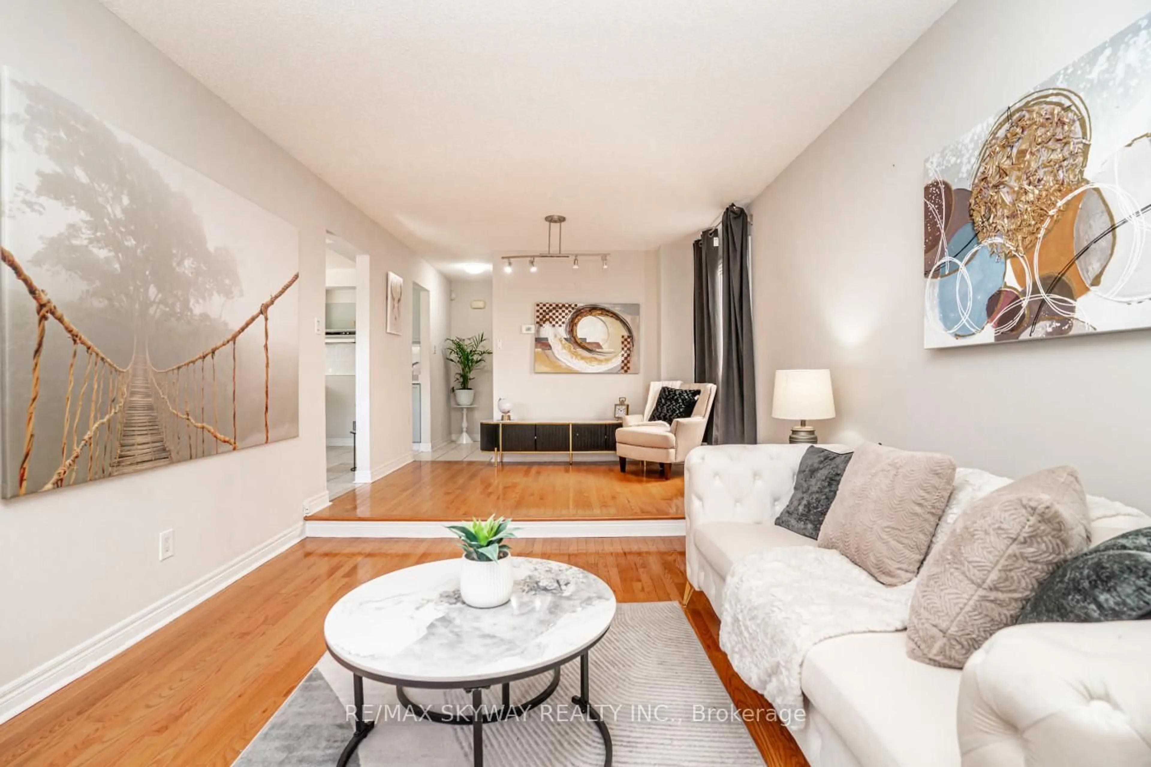 Living room with furniture, wood/laminate floor for 15 Cresswell Dr, Brampton Ontario L6Y 2T5