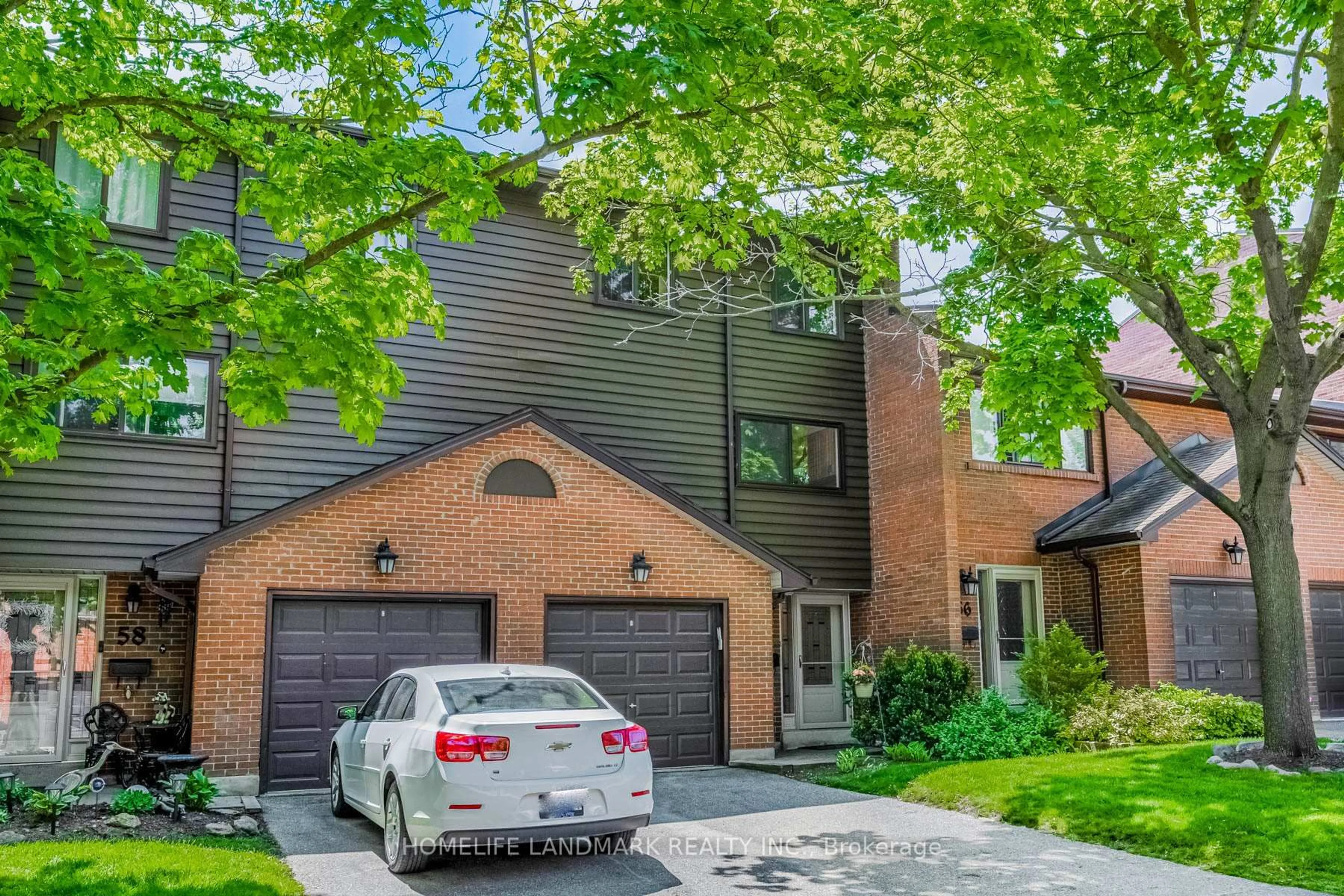 Home with brick exterior material, street for 4165 Fieldgate Dr #57, Mississauga Ontario L4W 2M9