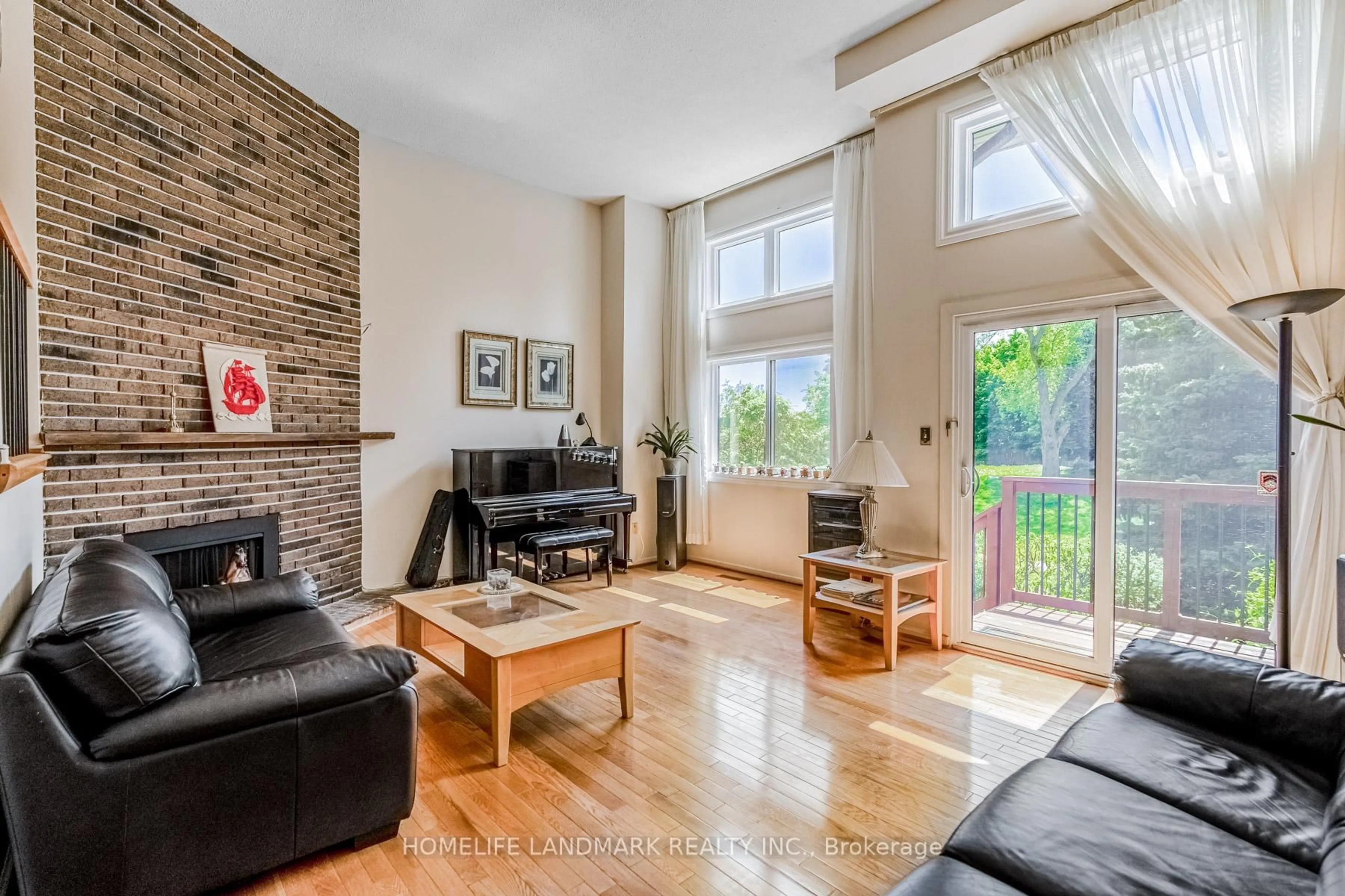 Living room with furniture, wood/laminate floor for 4165 Fieldgate Dr #57, Mississauga Ontario L4W 2M9