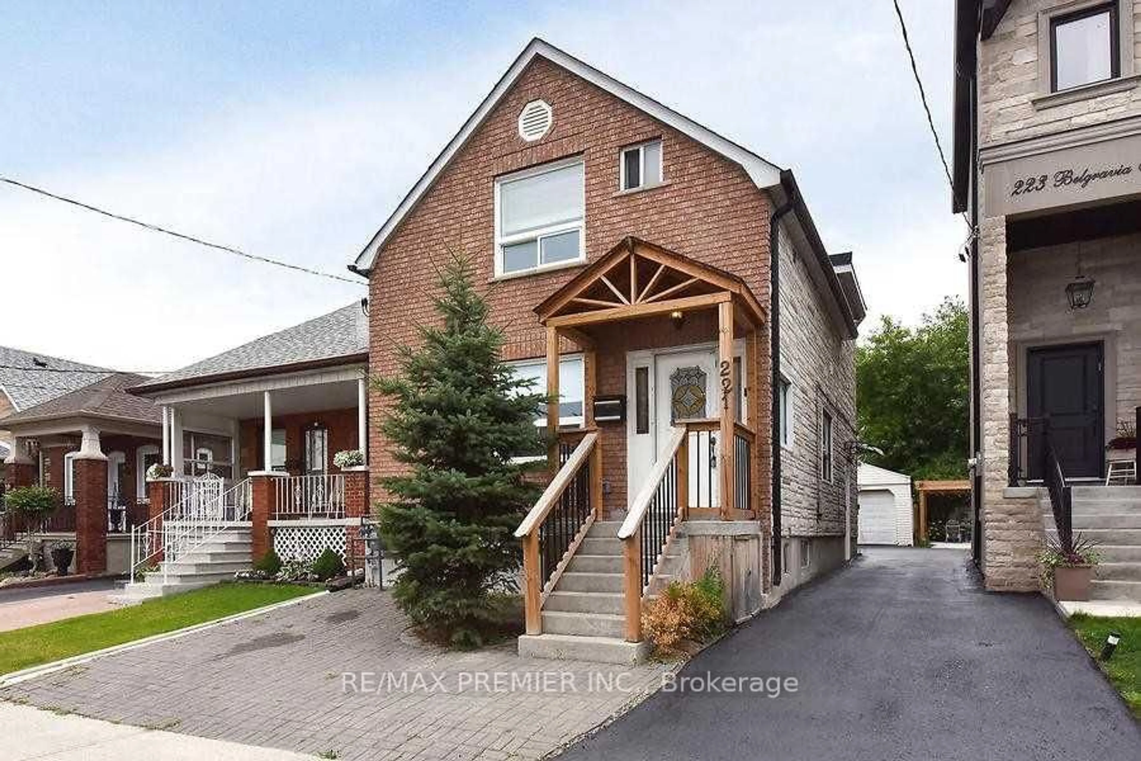 Home with brick exterior material, street for 221 Belgravia Ave, Toronto Ontario M6E 2M9