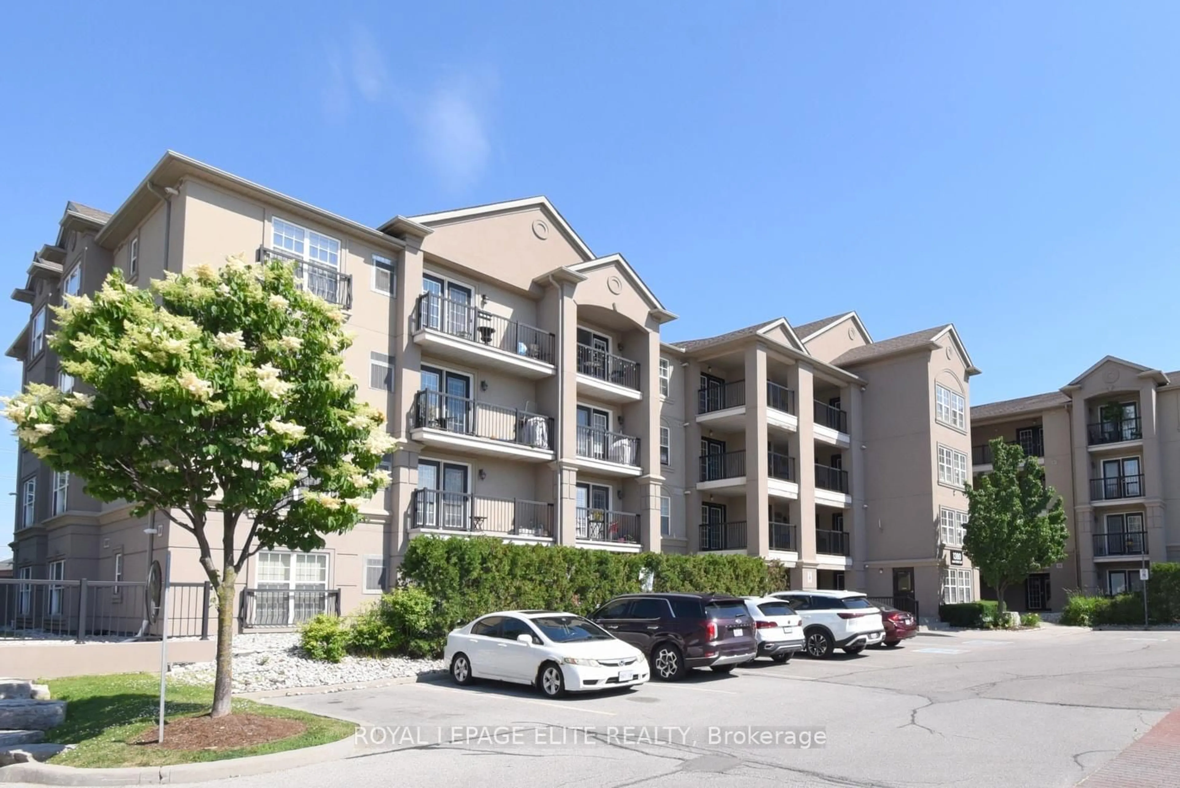 A pic from outside/outdoor area/front of a property/back of a property/a pic from drone, street for 1380 Main St #303, Milton Ontario L9T 7S4