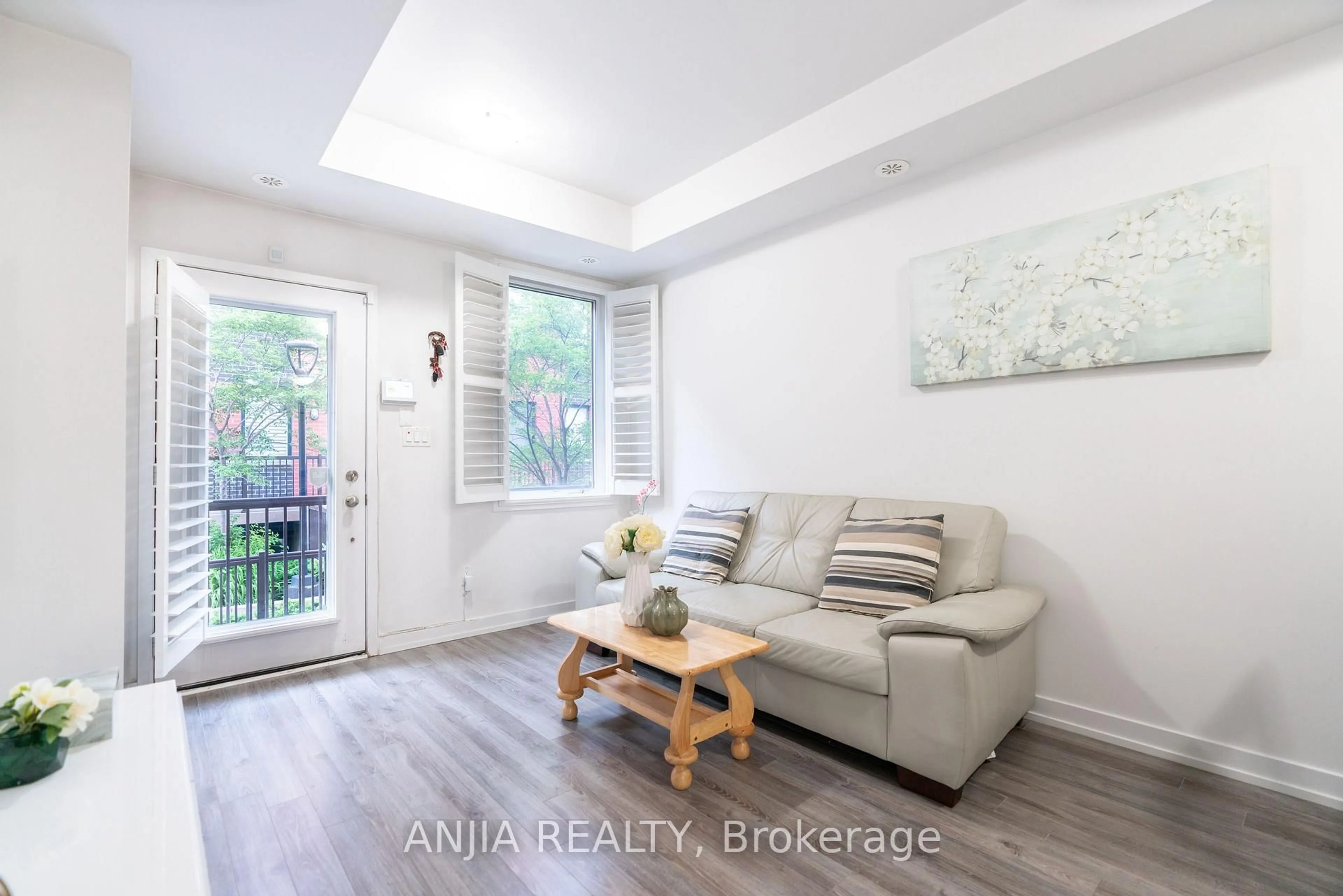 Living room with furniture, wood/laminate floor for 869 Wilson Ave #33, Toronto Ontario M3K 0A4