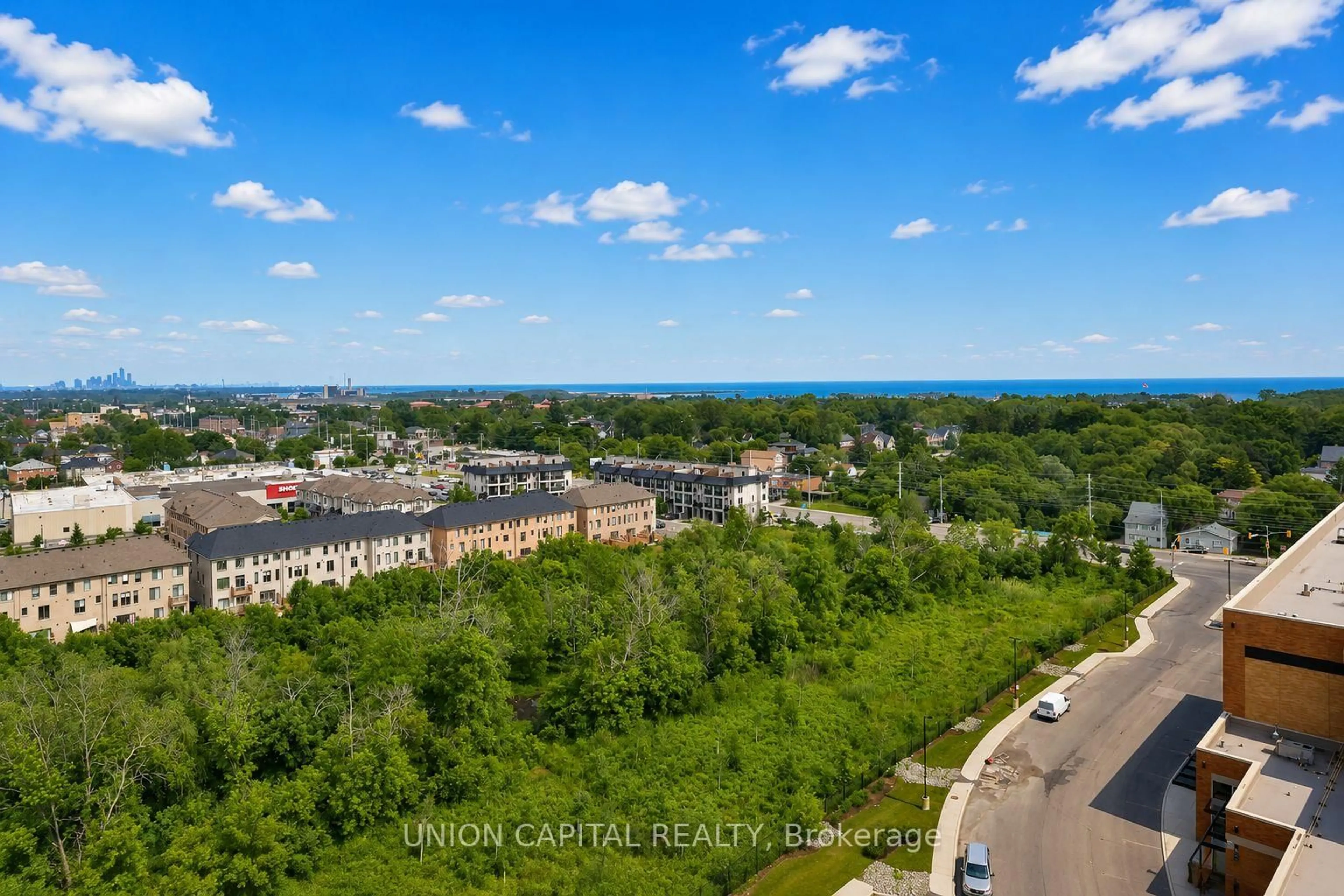 A pic from outside/outdoor area/front of a property/back of a property/a pic from drone, city buildings view from balcony for 1063 Douglas McCurdy Common #1104, Mississauga Ontario L5G 0C5