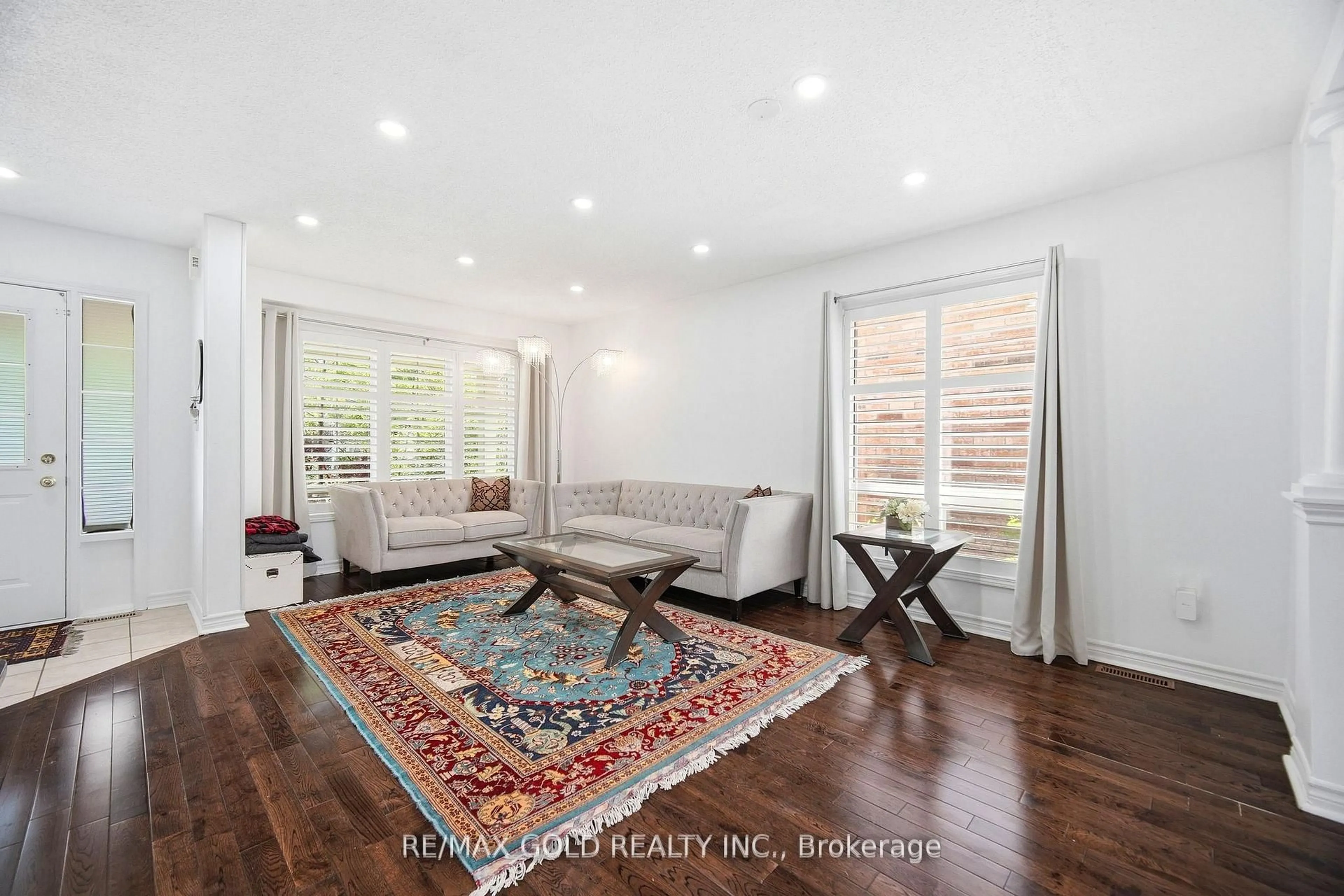 Living room with furniture, wood/laminate floor for 1523 Beaty Tr, Milton Ontario L9T 5V3