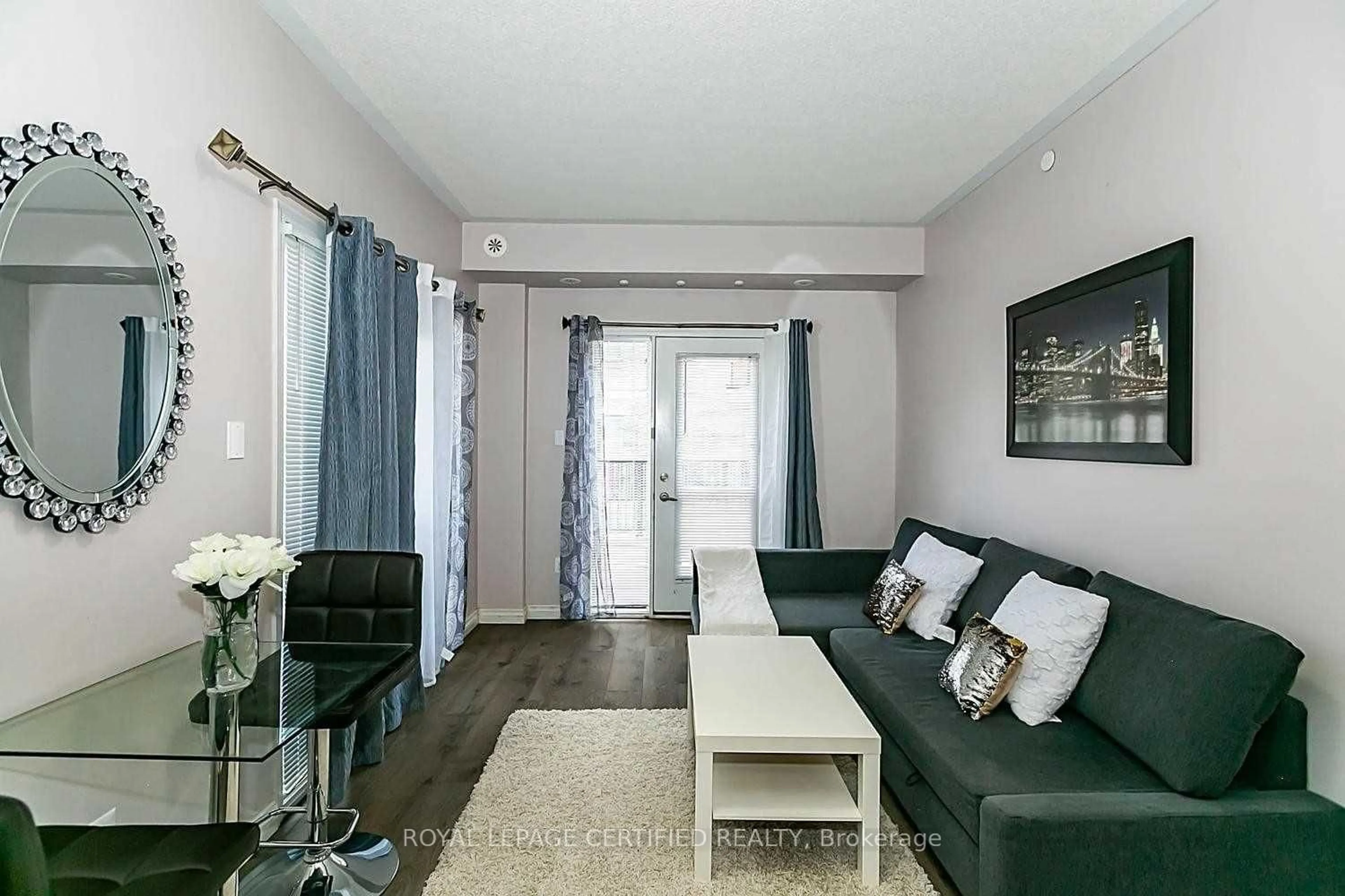 Living room with furniture, unknown for 3075 Thomas St #103, Mississauga Ontario L5M 0L8