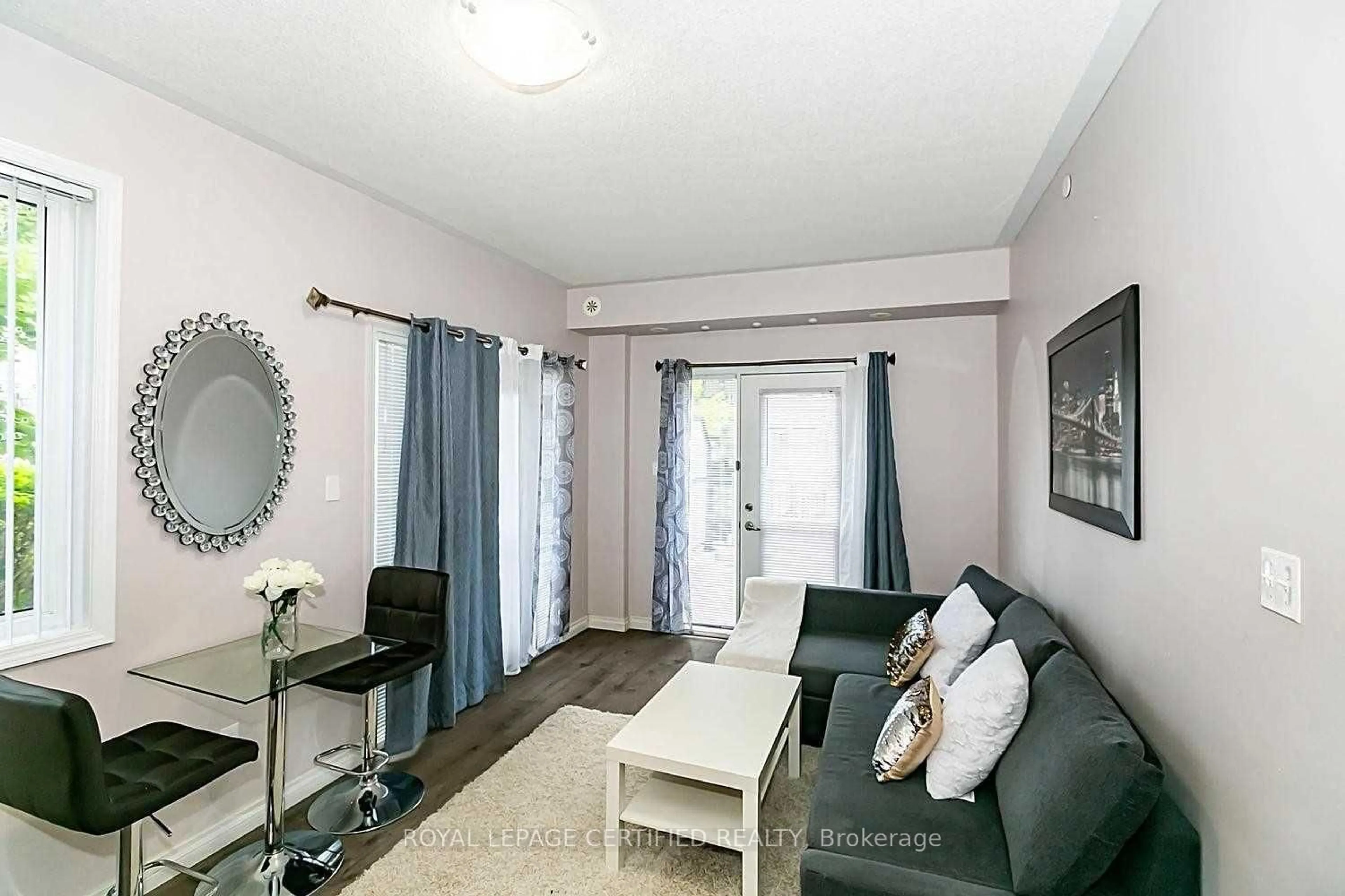 Living room with furniture, unknown for 3075 Thomas St #103, Mississauga Ontario L5M 0L8