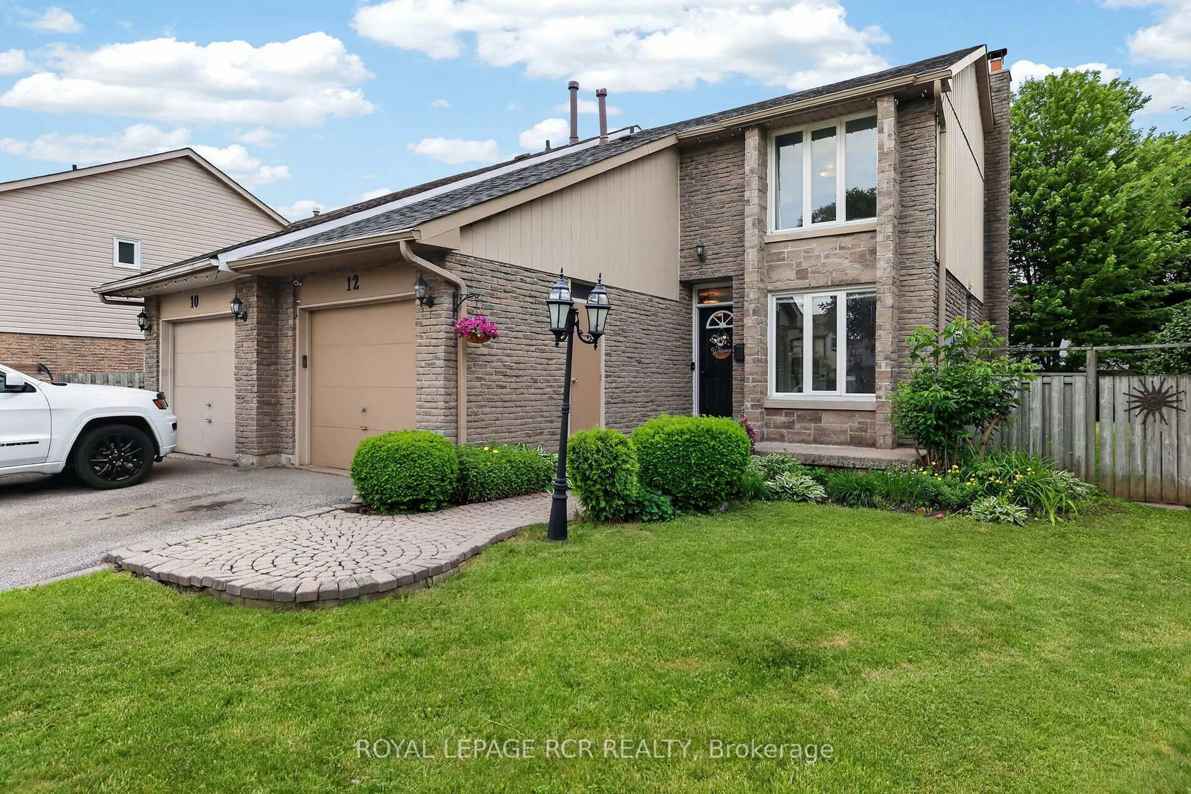 Home with brick exterior material, street for 12 Macassa Crt, Brampton Ontario L6Z 1B3