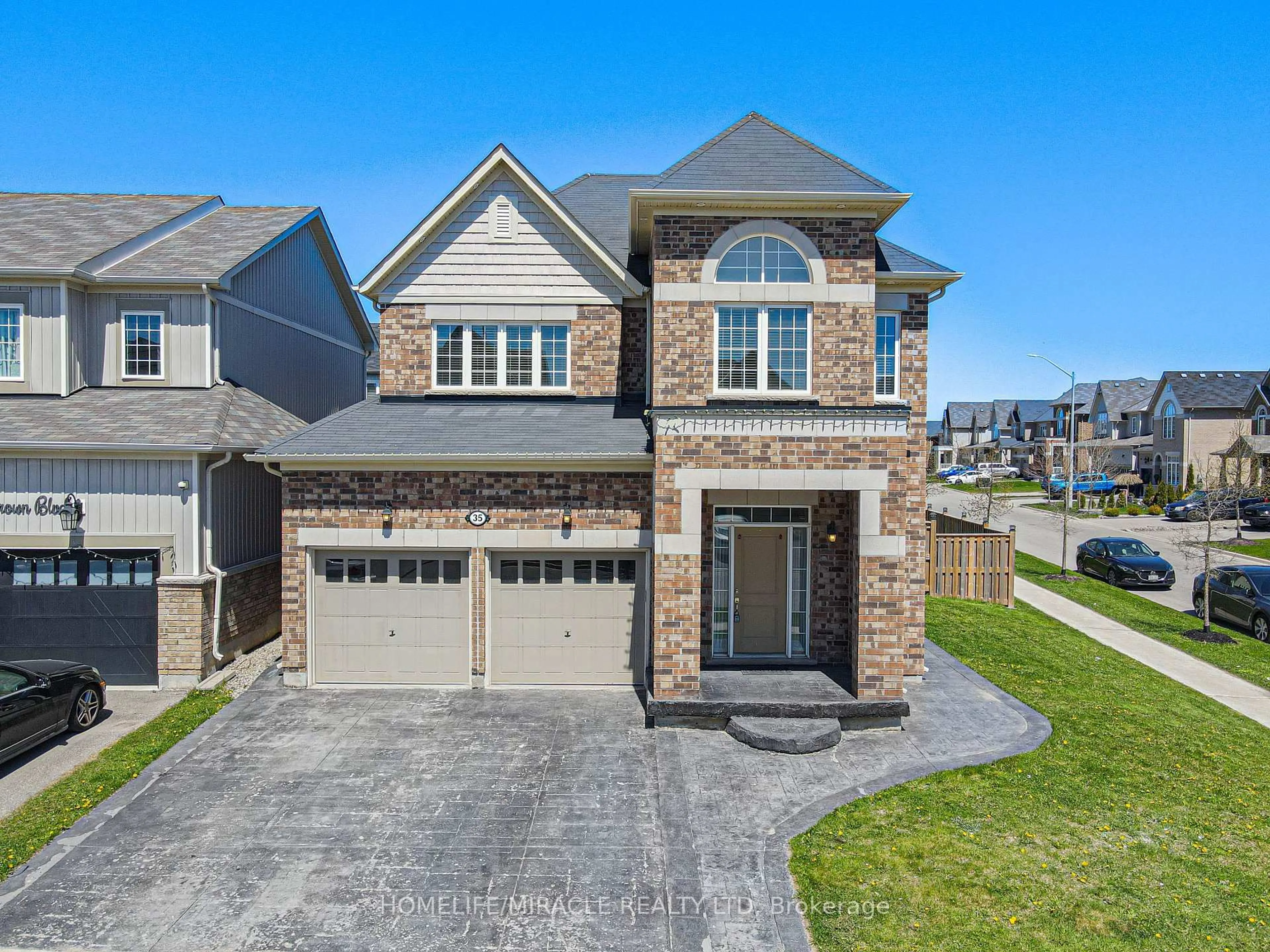 Home with brick exterior material, street for 35 Drew Brown Blvd, Orangeville Ontario L9W 6Z6