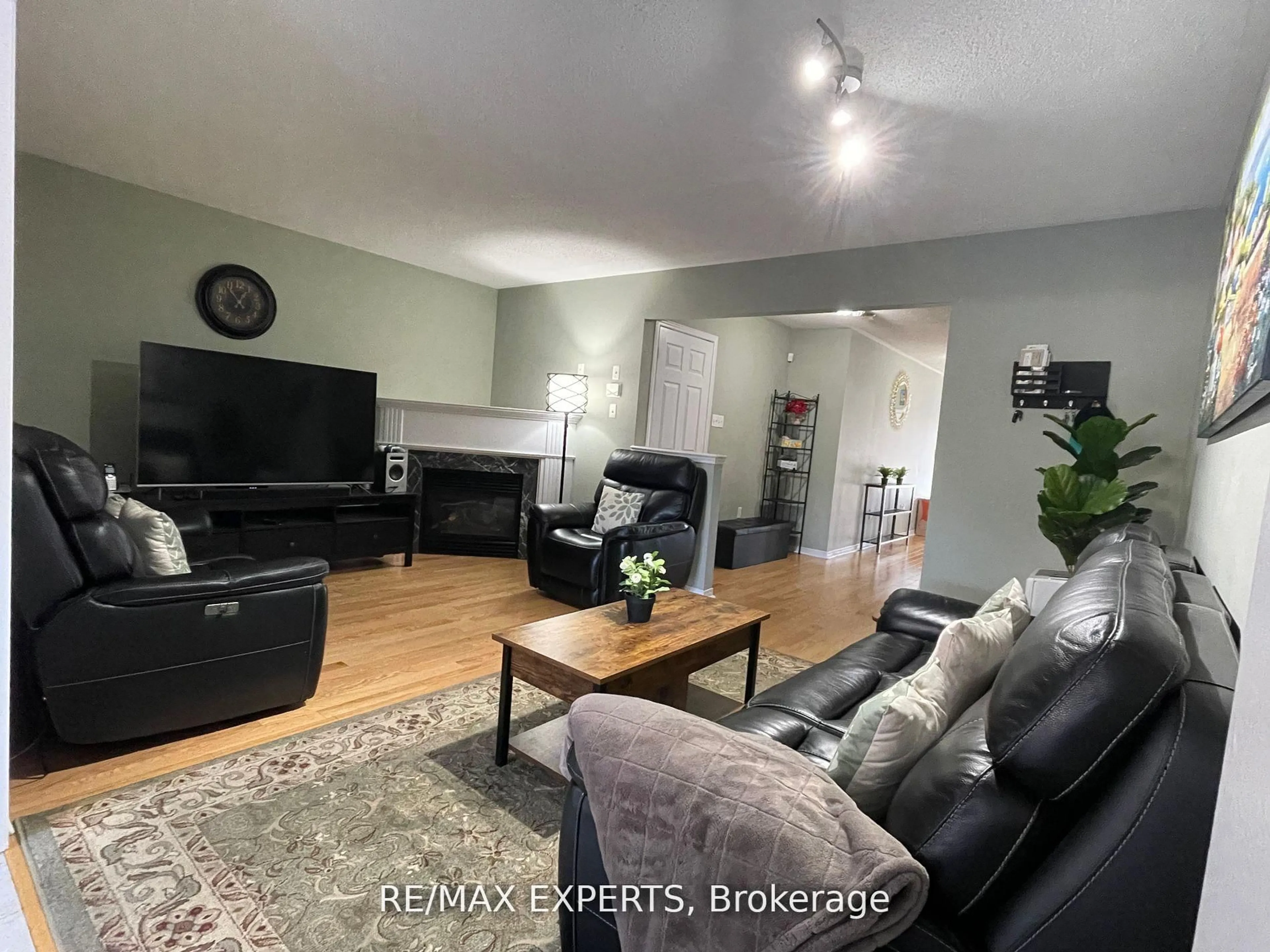 Living room with furniture, wood/laminate floor for 3769 Nightstar Dr, Mississauga Ontario L5M 8A5