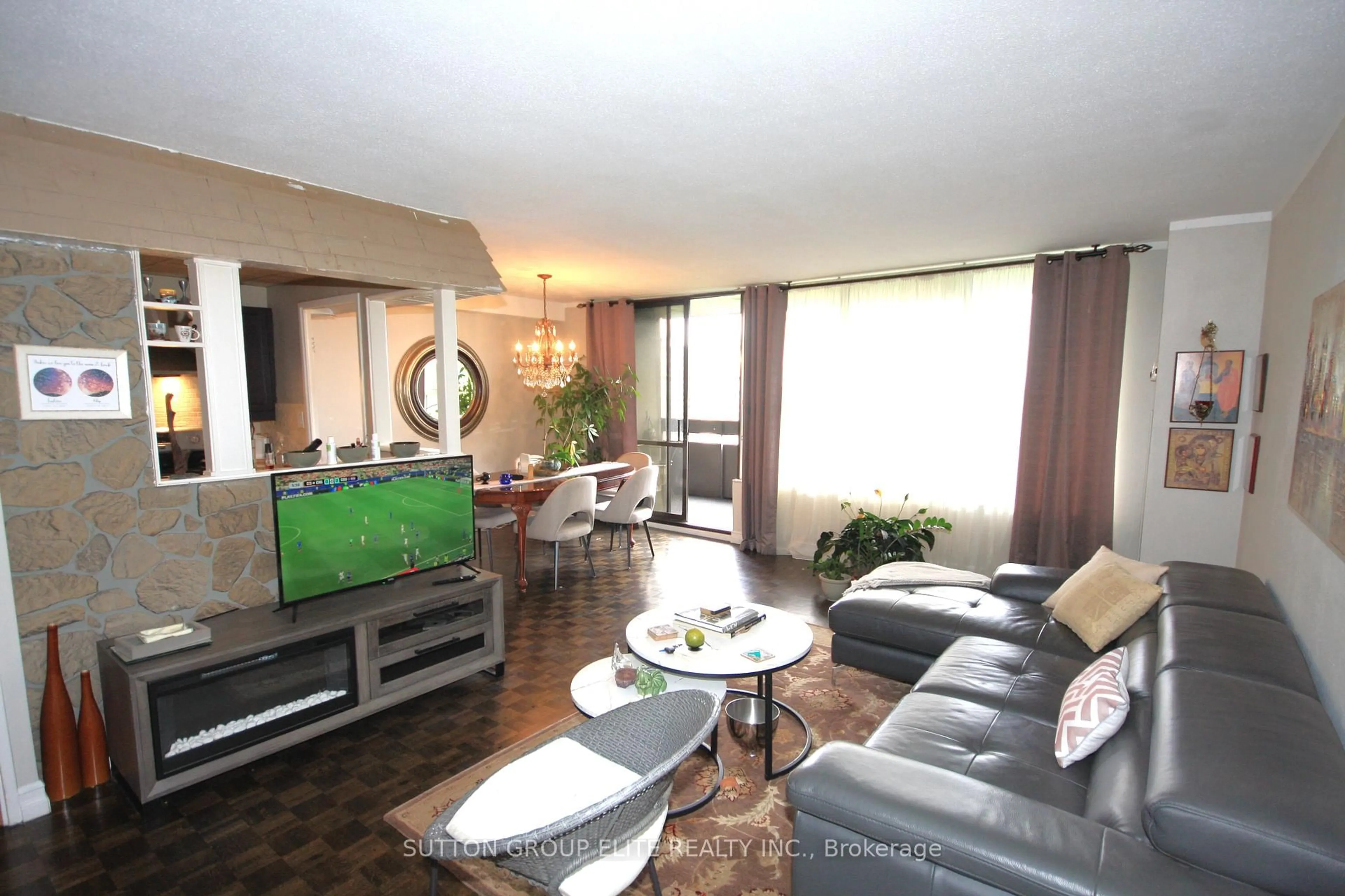 Living room with furniture, unknown for 11 Wincott Dr #1110, Toronto Ontario M9R 2R9