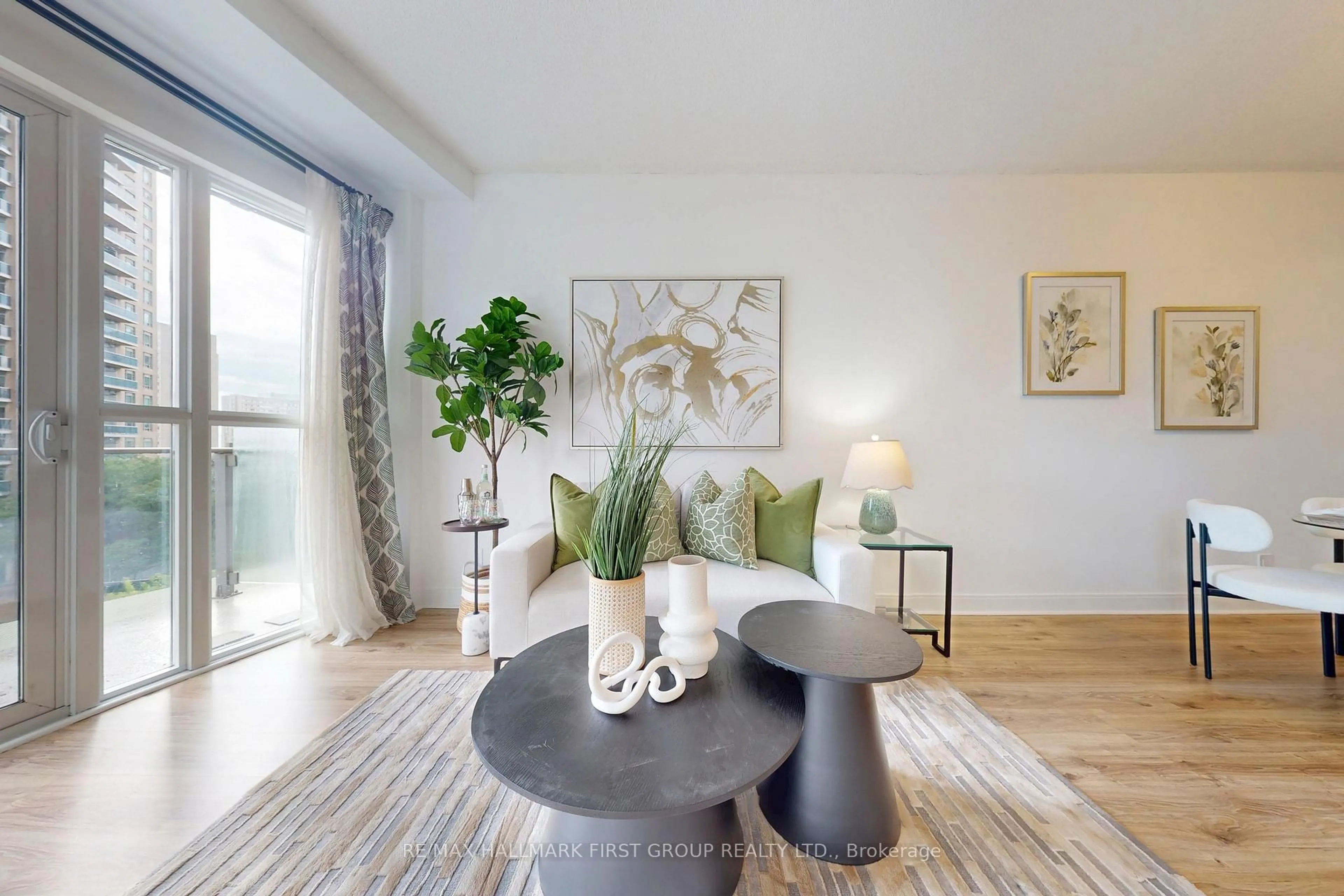 Living room with furniture, wood/laminate floor for 50 Absolute Ave #603, Mississauga Ontario L4Z 0A8