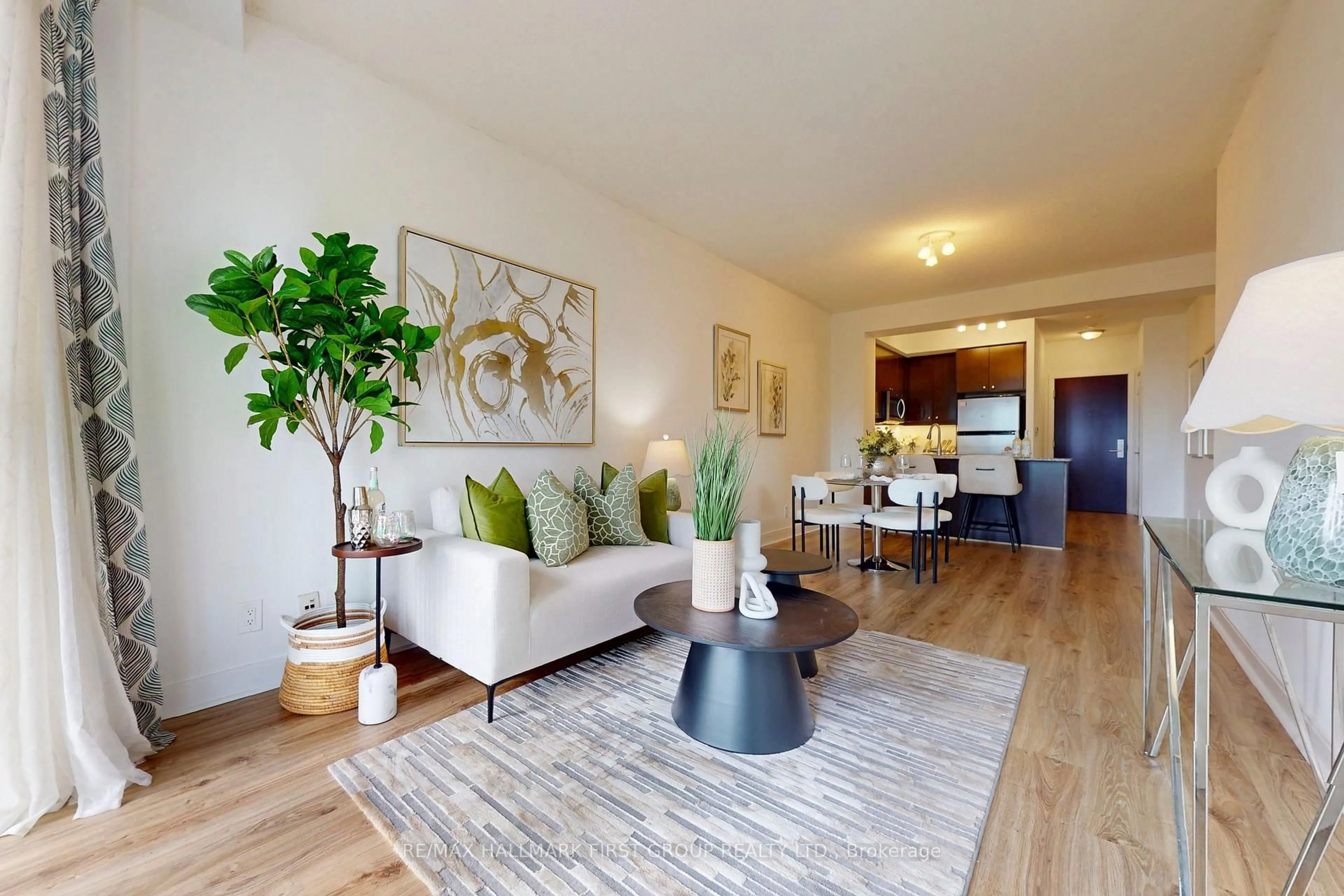 Living room with furniture, wood/laminate floor for 50 Absolute Ave #603, Mississauga Ontario L4Z 0A8