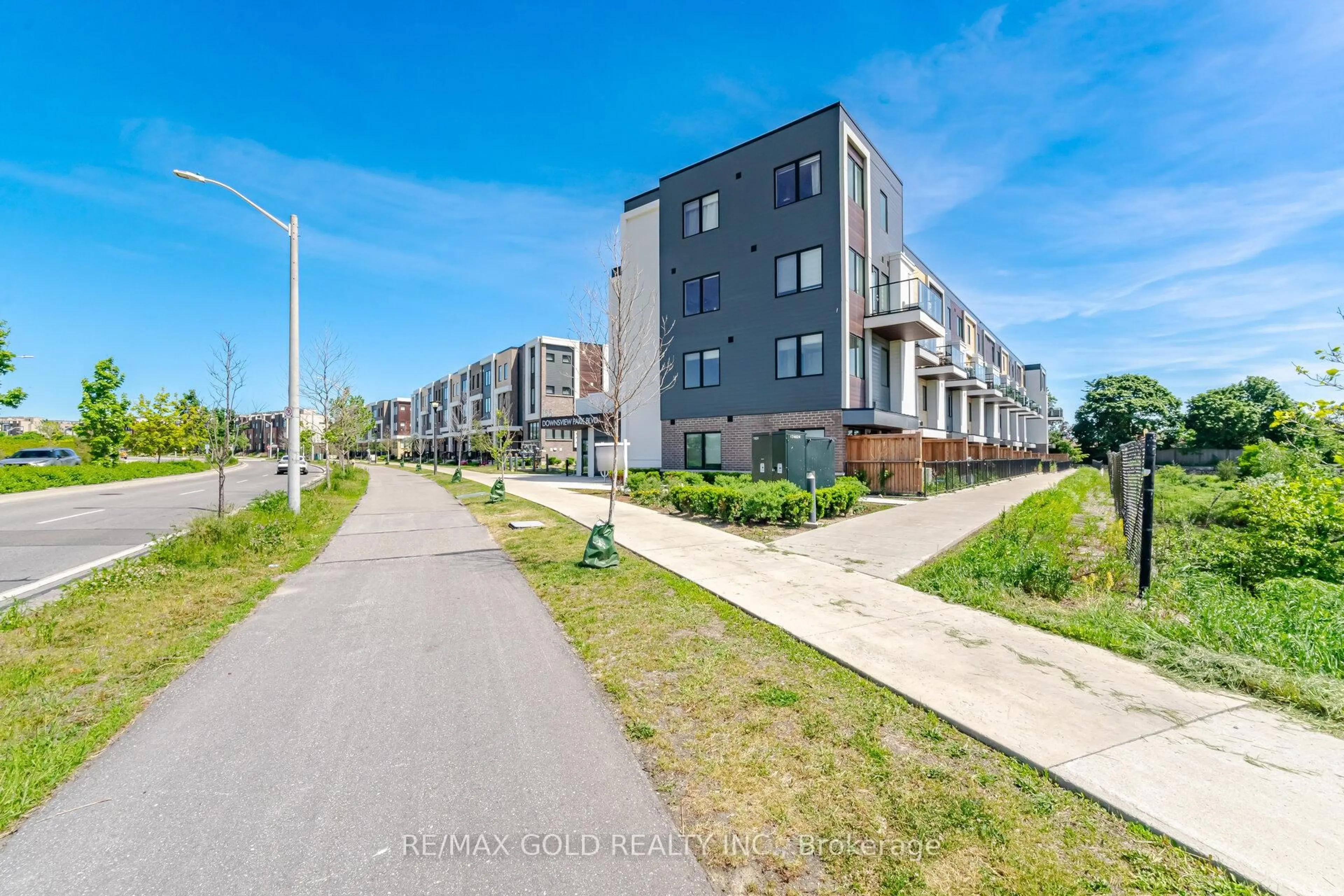 A pic from outside/outdoor area/front of a property/back of a property/a pic from drone, street for 155 Downsview Park Blvd #204, Toronto Ontario M3K 0E3
