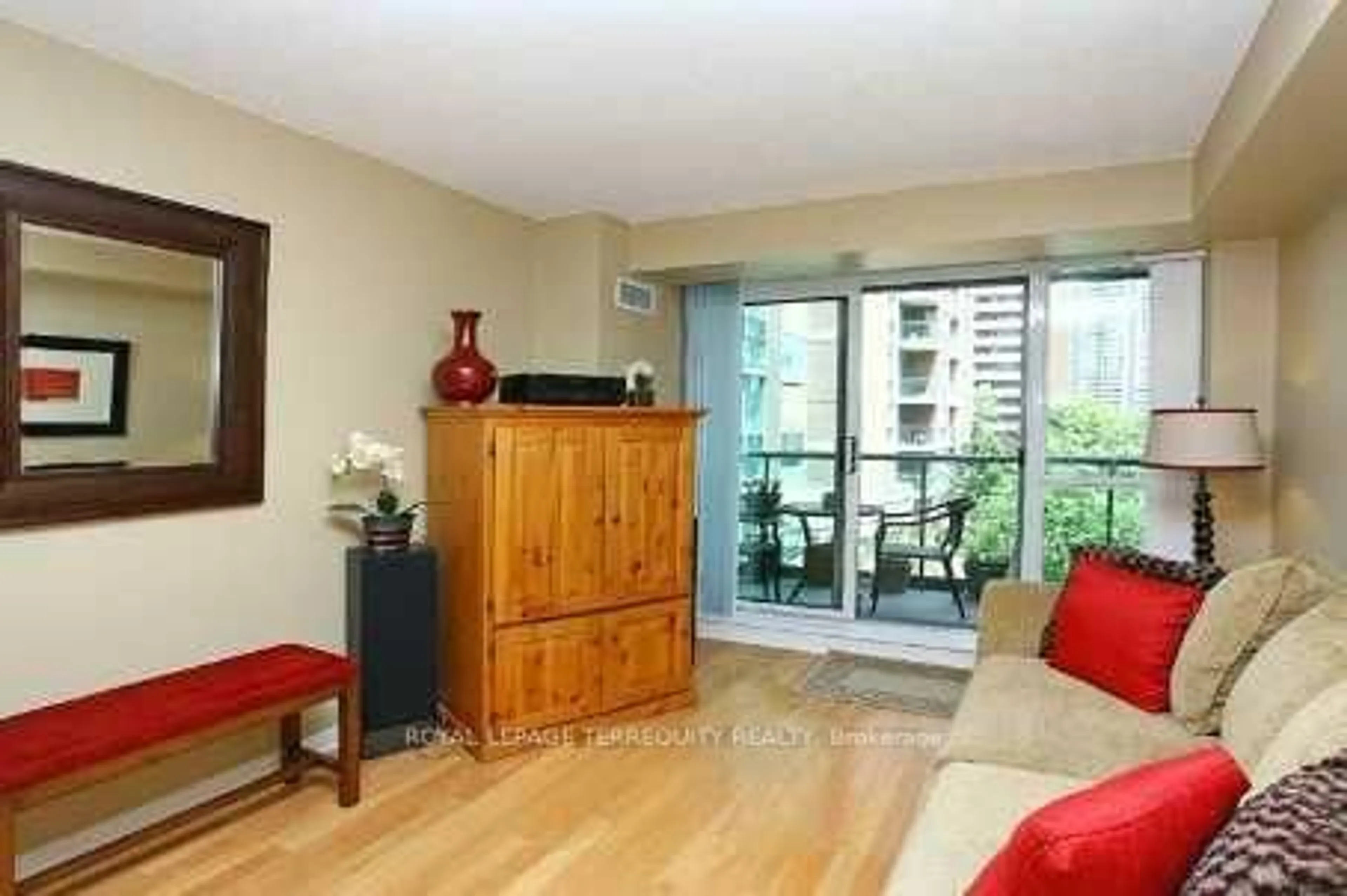 Living room with furniture, wood/laminate floor for 11 Michael Power Pl #301, Toronto Ontario M9A 5G3