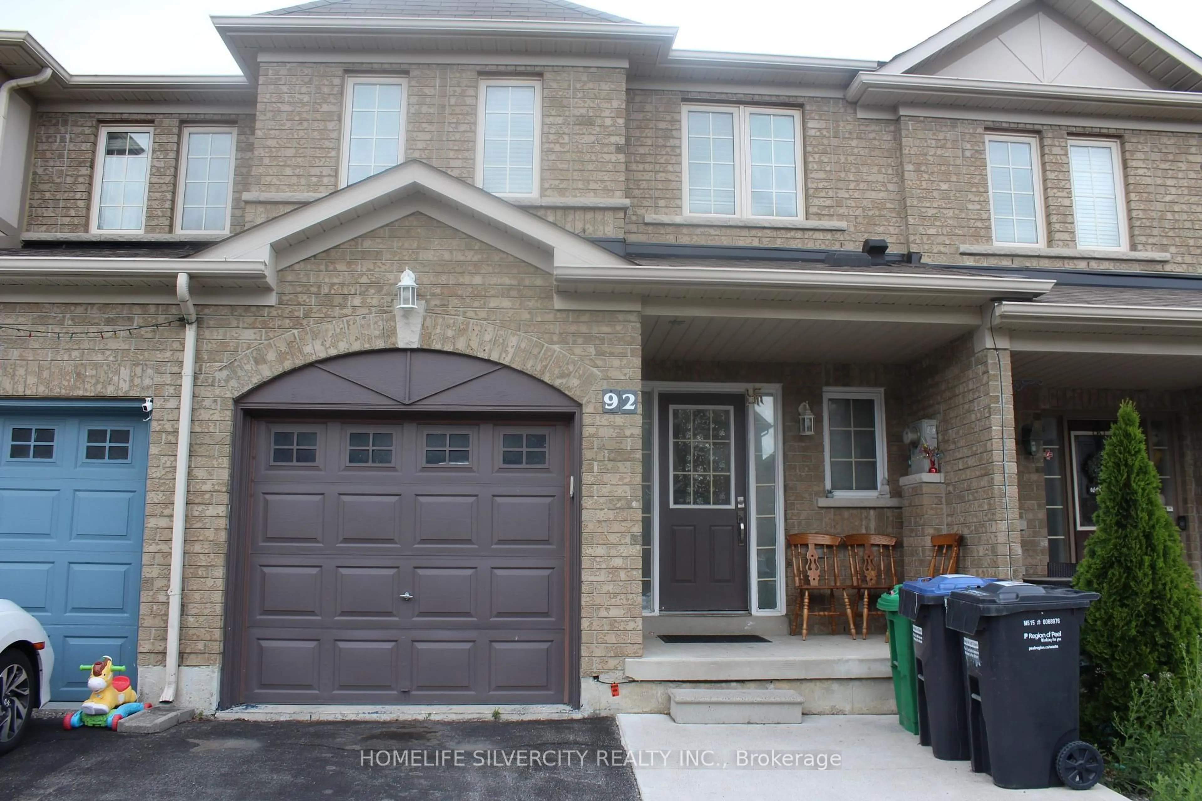 Home with brick exterior material, street for 92 Tomabrook Cres, Brampton Ontario L6R 0V4