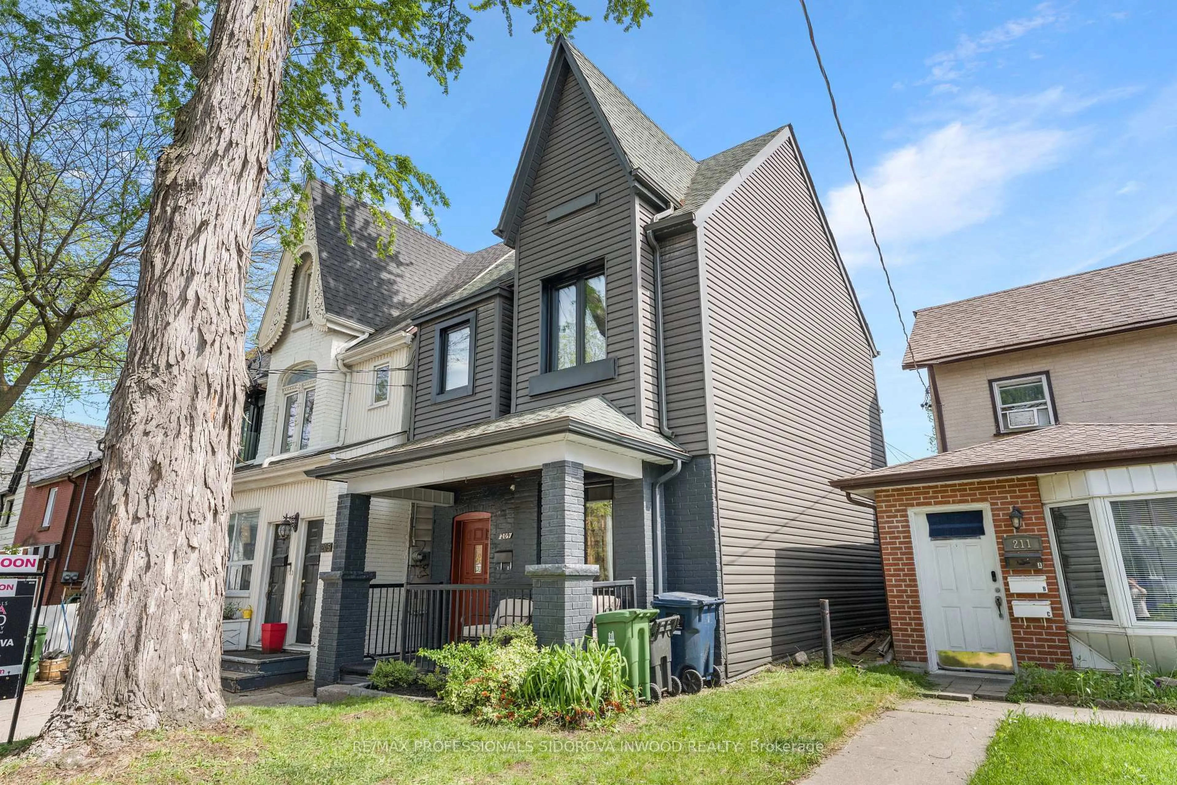 Home with brick exterior material, street for 209 Maria St, Toronto Ontario M6P 1W6