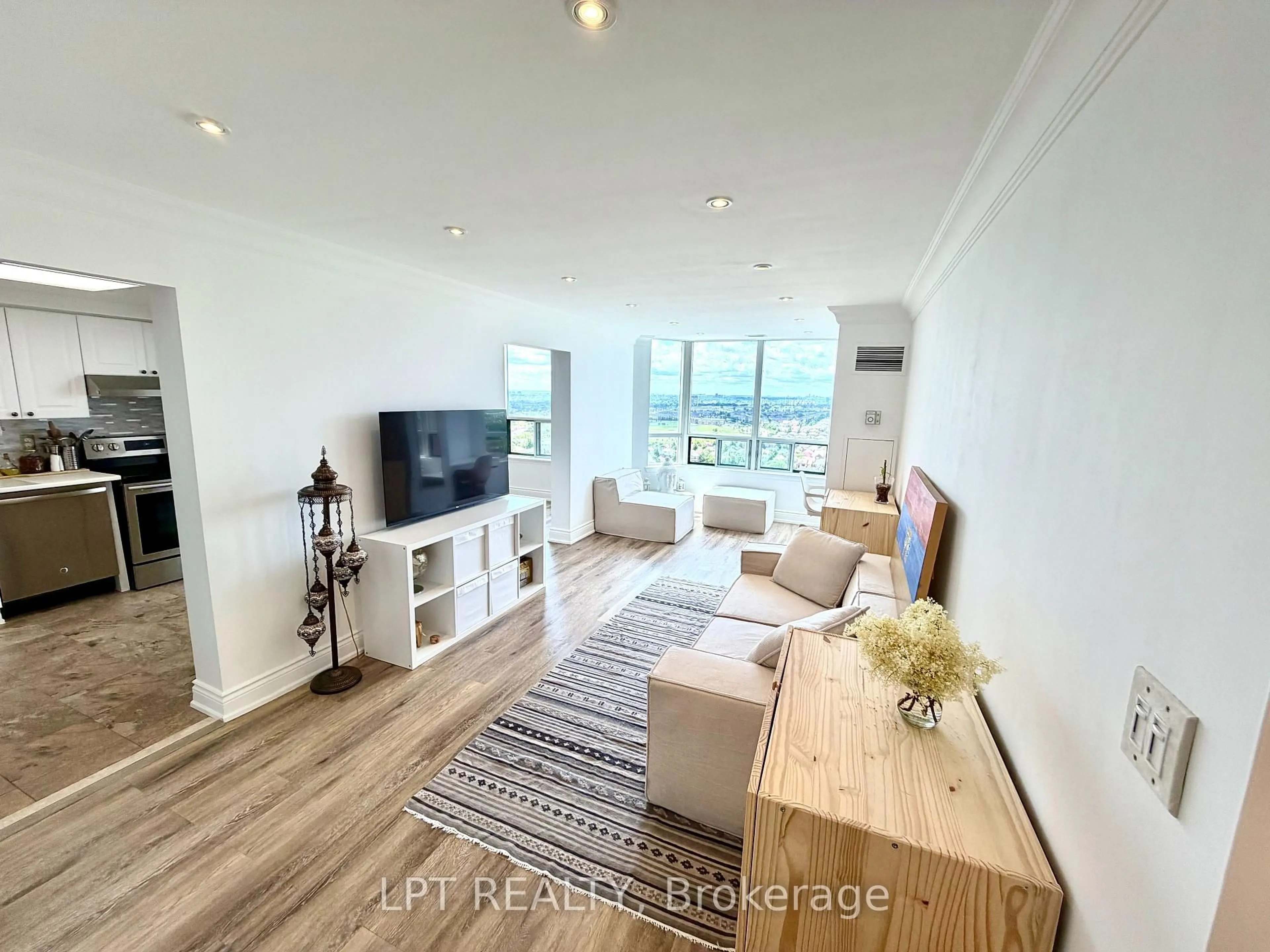 Living room with furniture, wood/laminate floor for 135 Hillcrest Ave #2307, Mississauga Ontario L5B 4B1