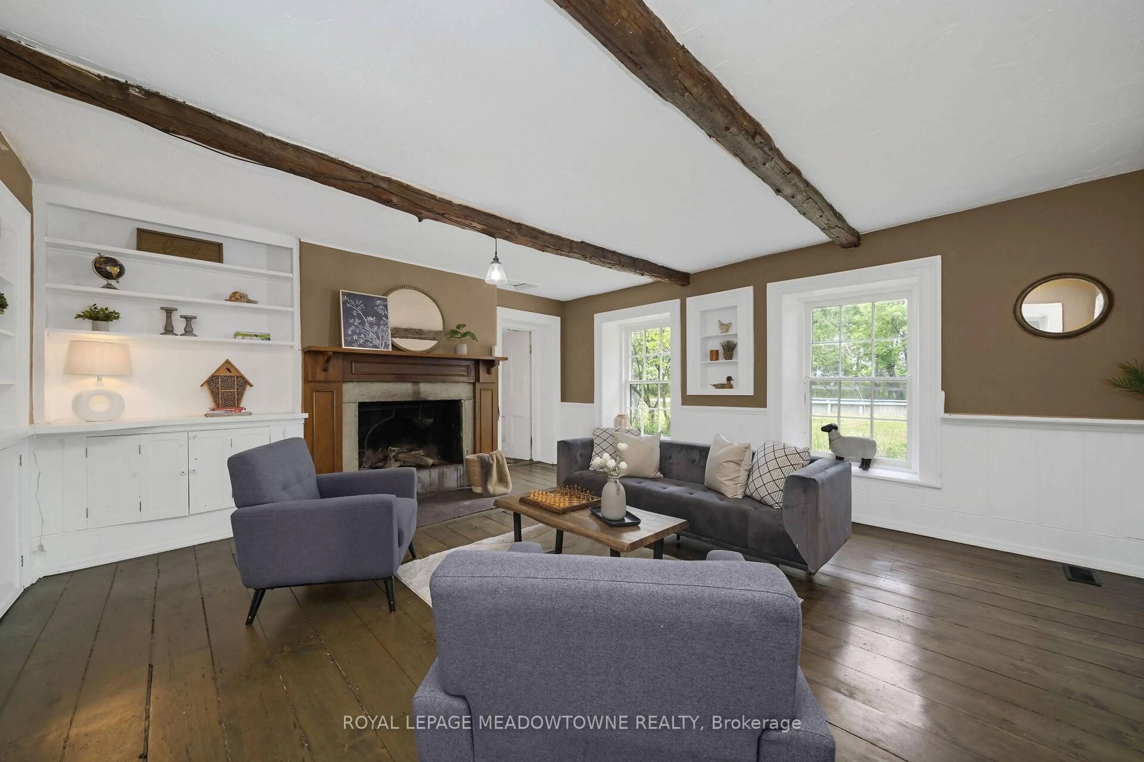 Living room with furniture, wood/laminate floor for 5595 25 Sdrd, Milton Ontario L7J 2L7