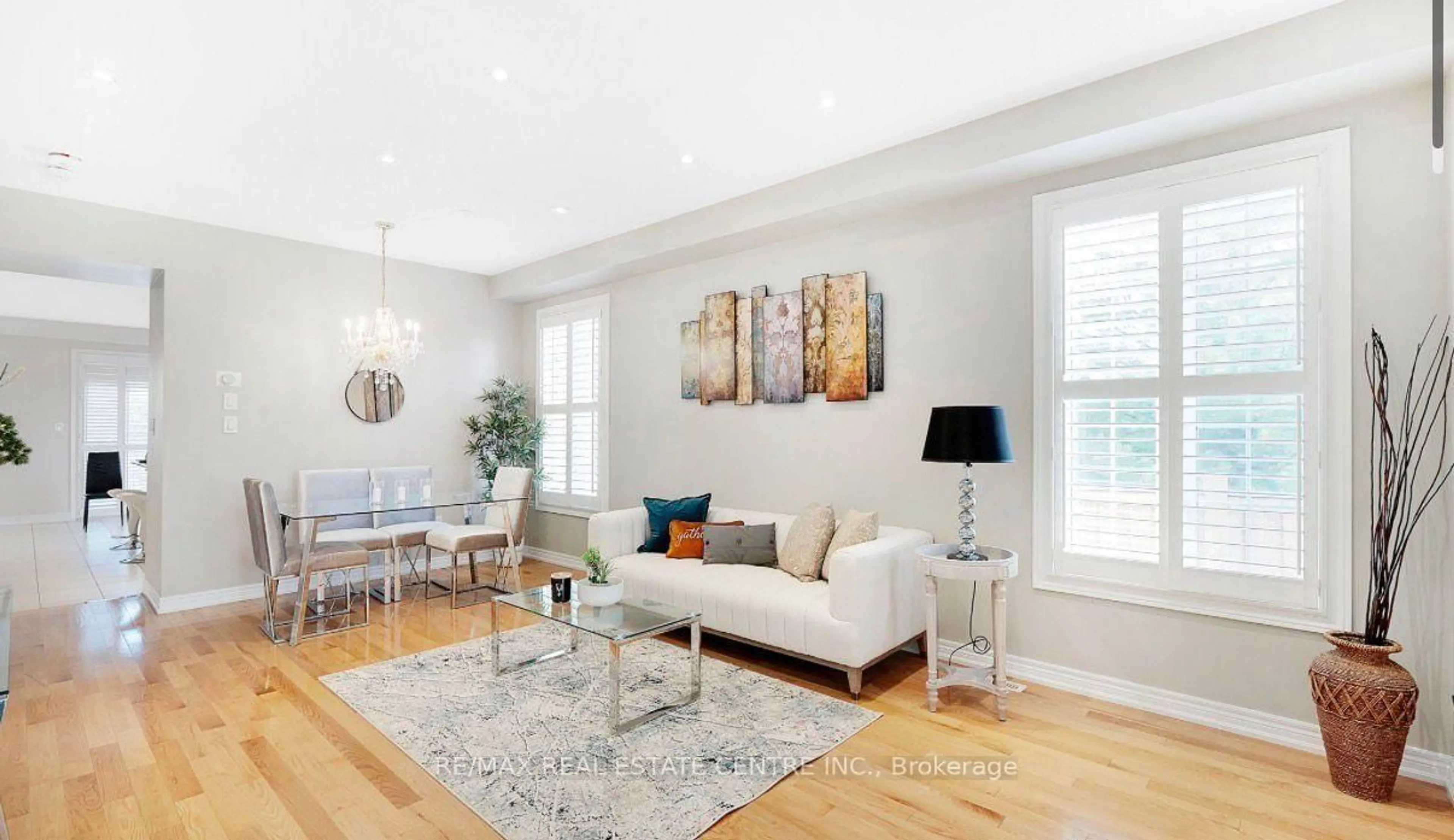 Living room with furniture, wood/laminate floor for 161 Bonnie Braes Dr, Brampton Ontario L6Y 5Z1