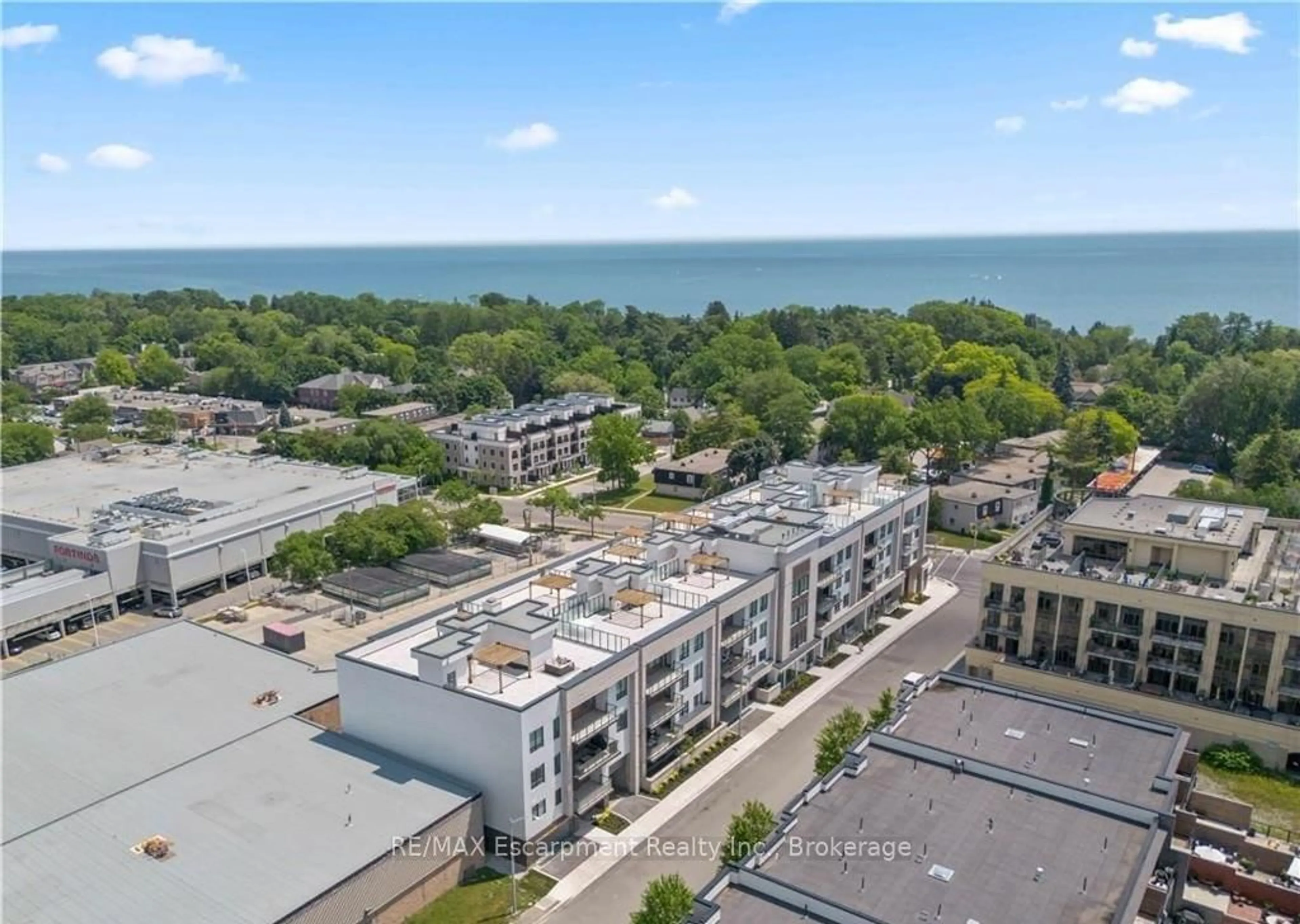 A pic from outside/outdoor area/front of a property/back of a property/a pic from drone, unknown for 123 Maurice Dr #303, Oakville Ontario L6K 2W6