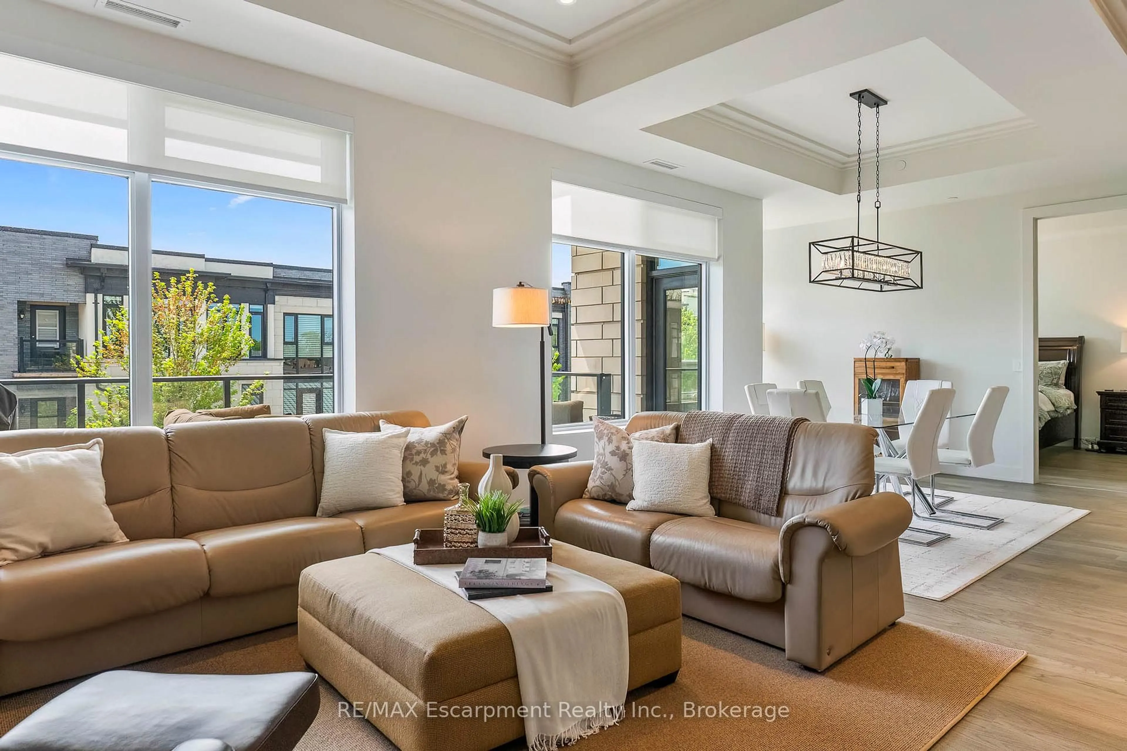 Living room with furniture, unknown for 123 Maurice Dr #303, Oakville Ontario L6K 2W6