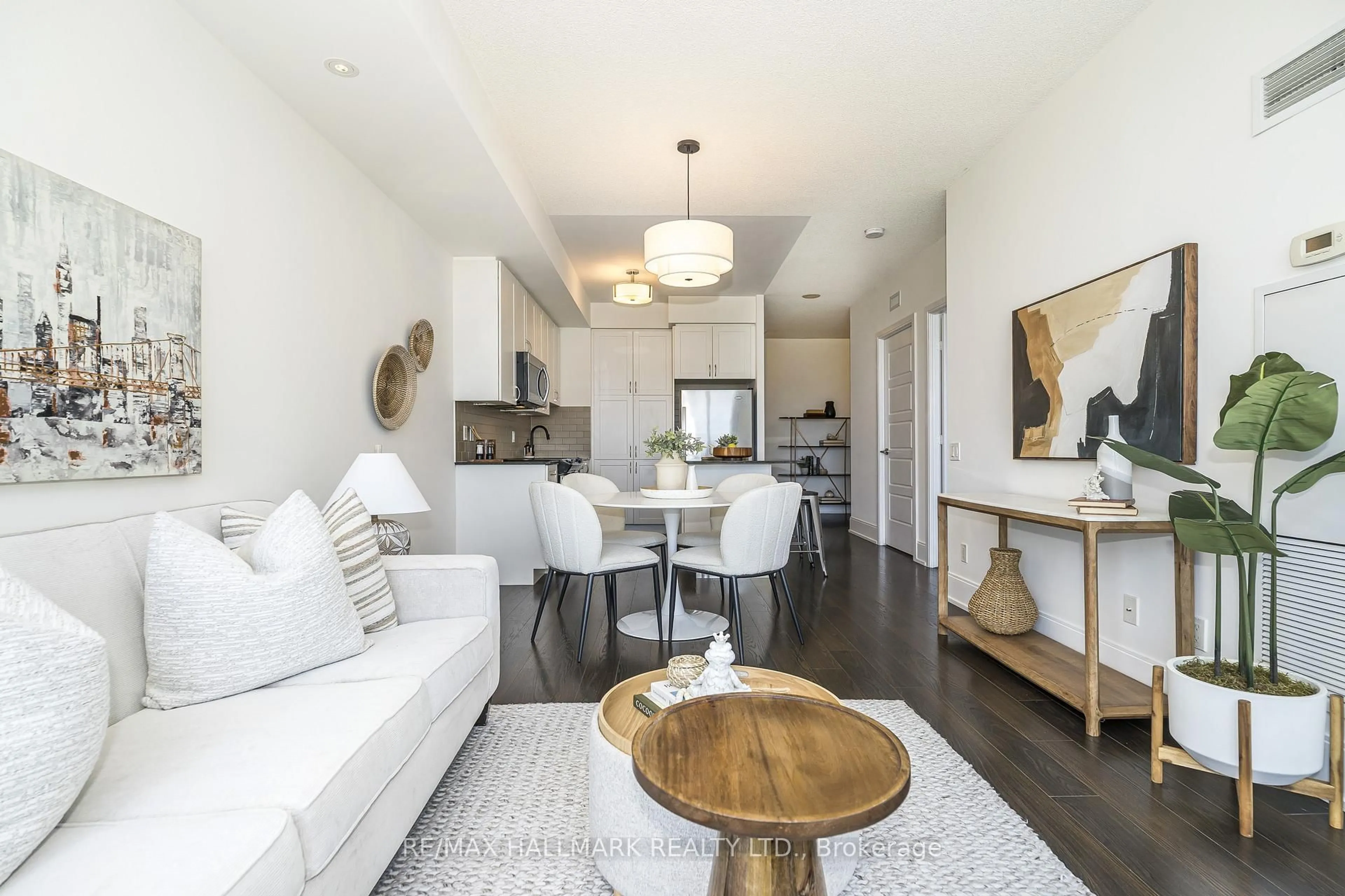 Living room with furniture, wood/laminate floor for 15 Viking Lane #1206, Toronto Ontario M9B 0A4