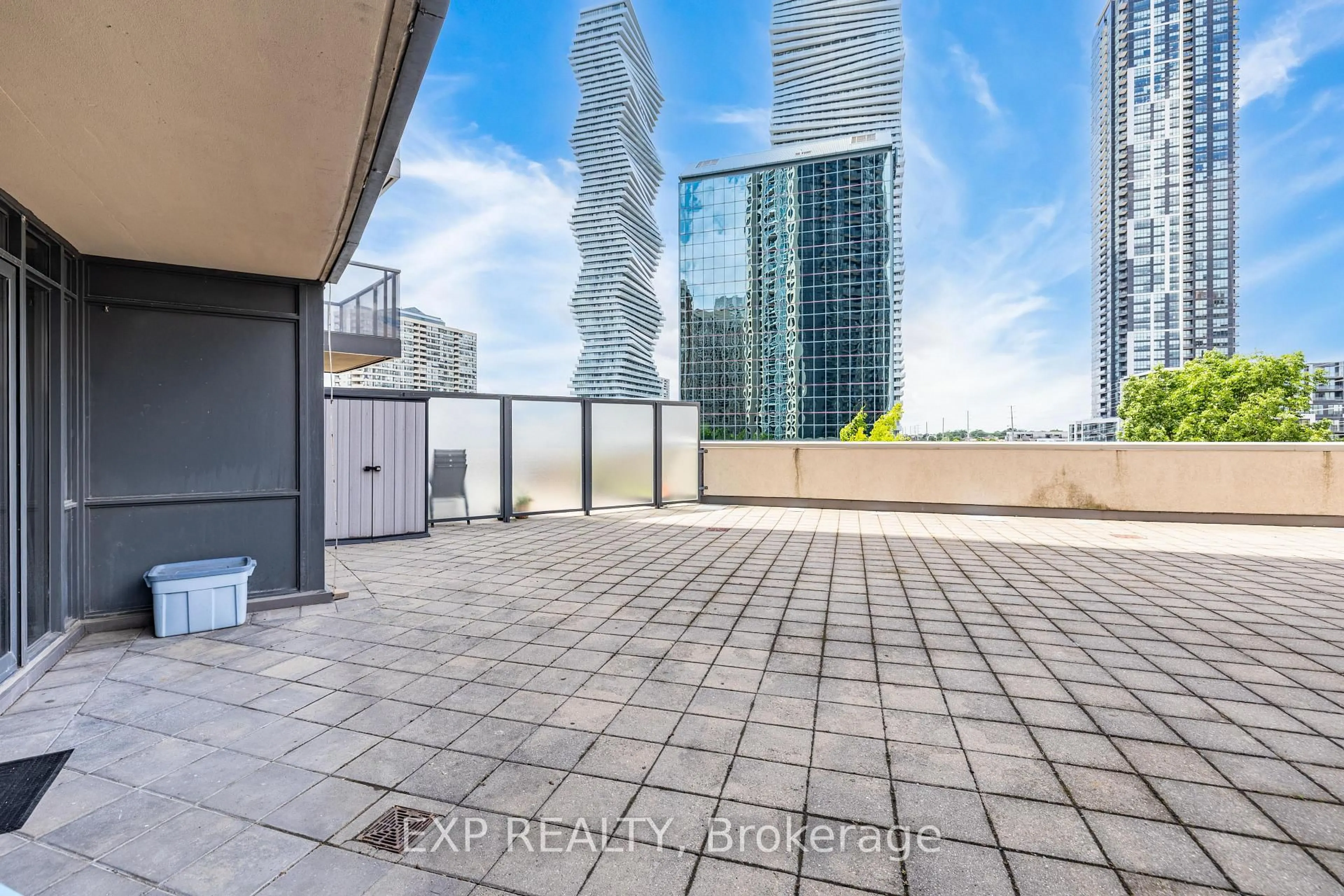 Patio, city buildings view from balcony for 330 Burnhamthorpe Rd #303, Mississauga Ontario L5B 0E1