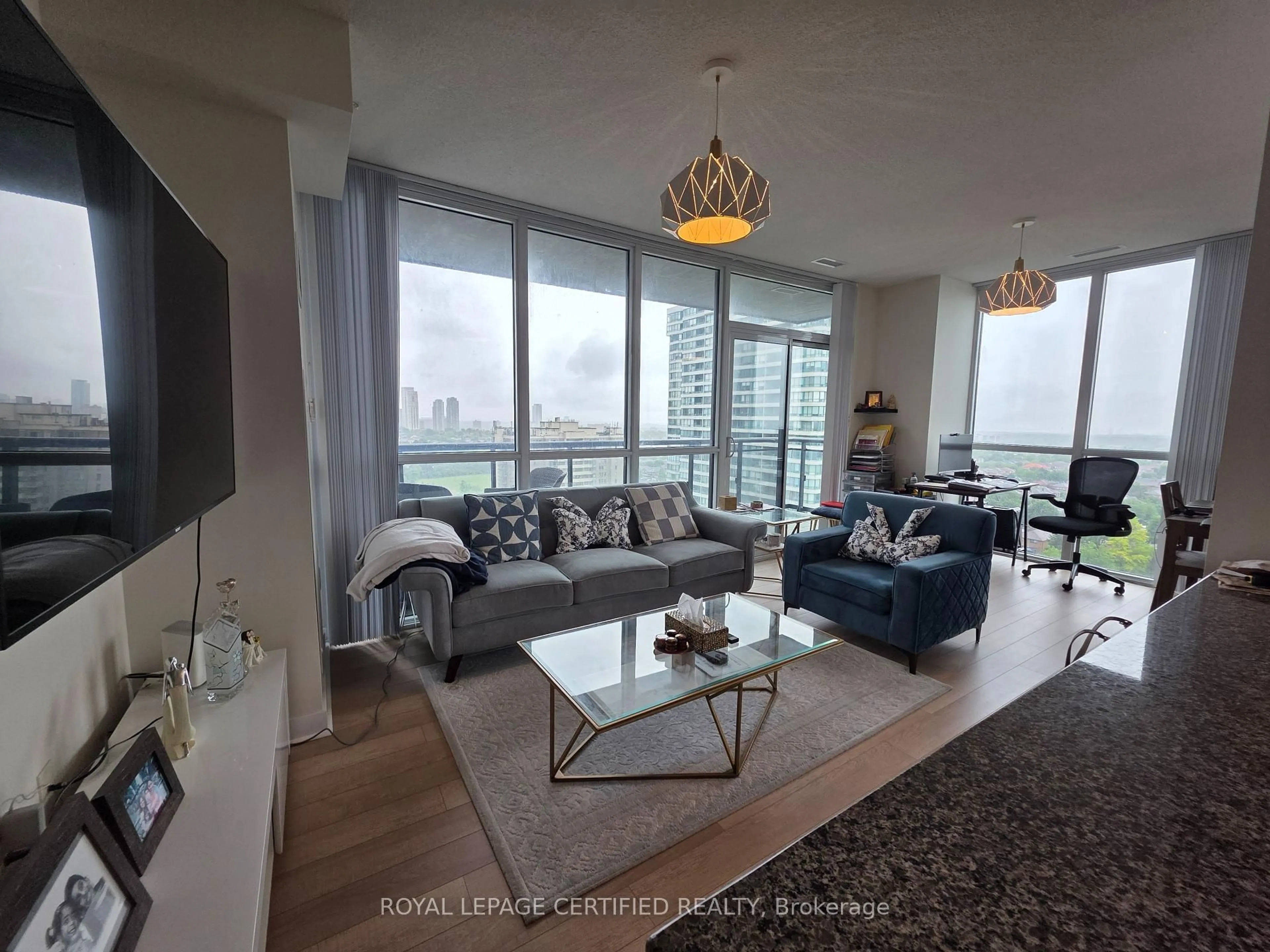 Living room with furniture, wood/laminate floor for 3975 Grand Park Dr #1302, Mississauga Ontario L5B 4M6