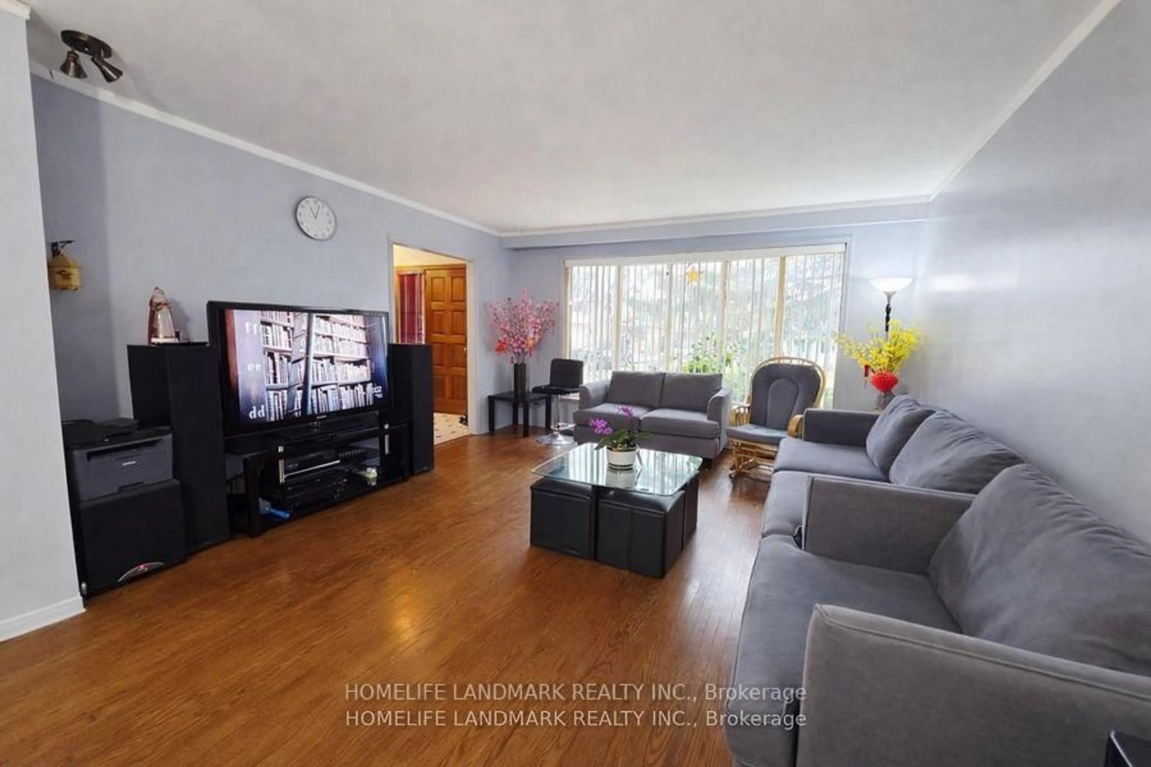 Living room with furniture, wood/laminate floor for 7 Burtonwood Cres, Toronto Ontario M9V 3L9