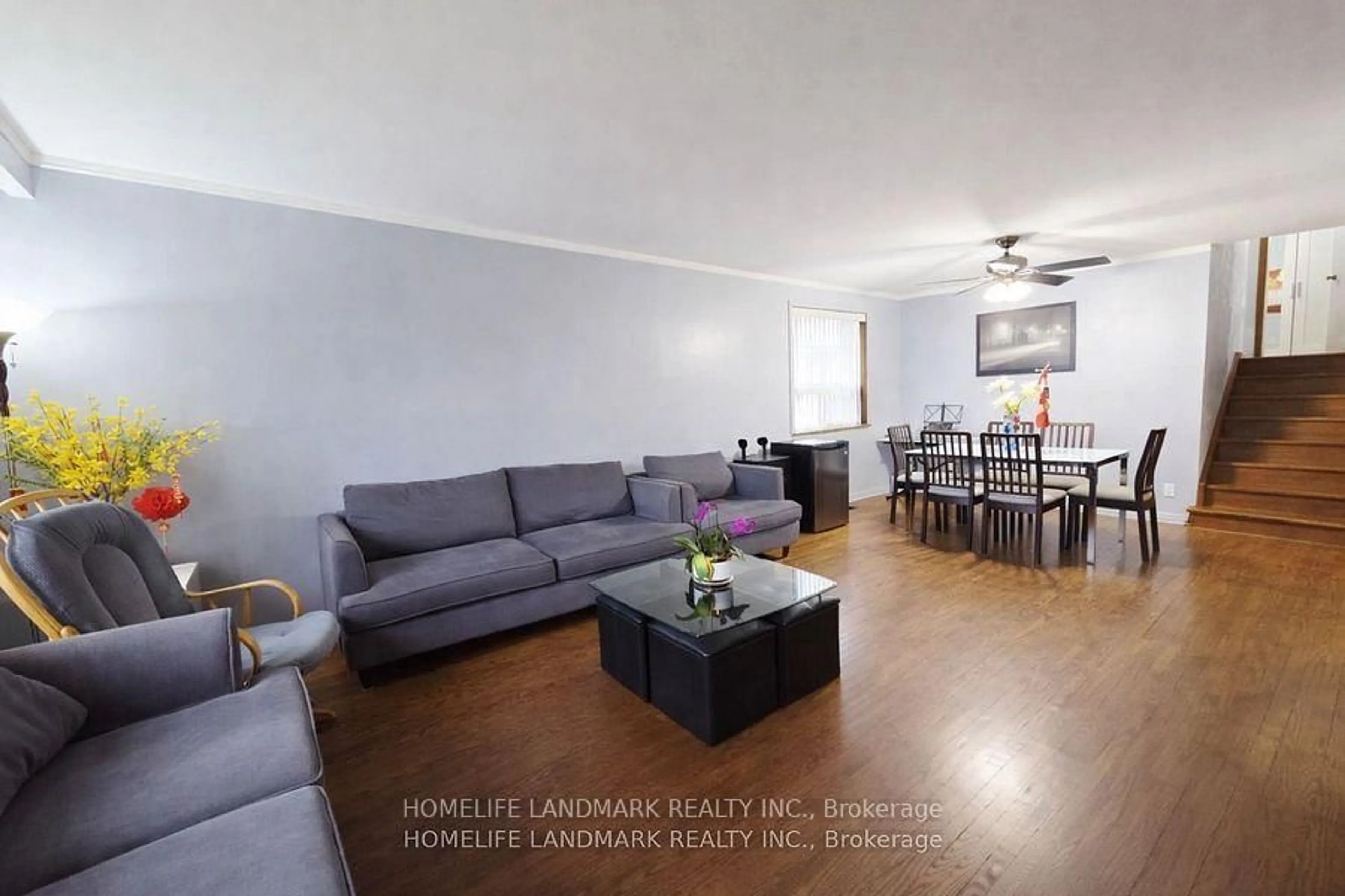 Living room with furniture, wood/laminate floor for 7 Burtonwood Cres, Toronto Ontario M9V 3L9