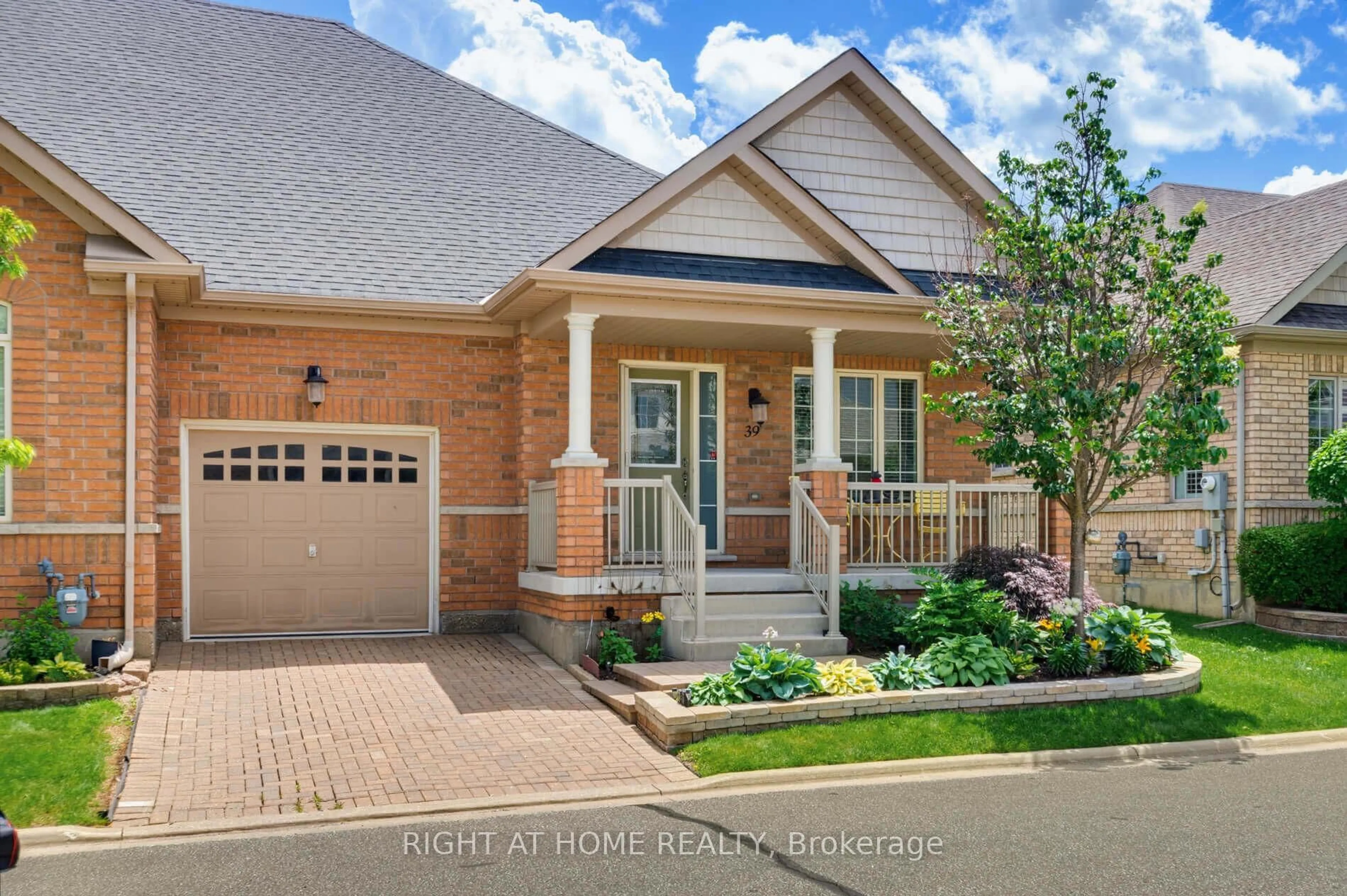 Home with brick exterior material, street for 39 Lacorra Way, Brampton Ontario L6R 3P2