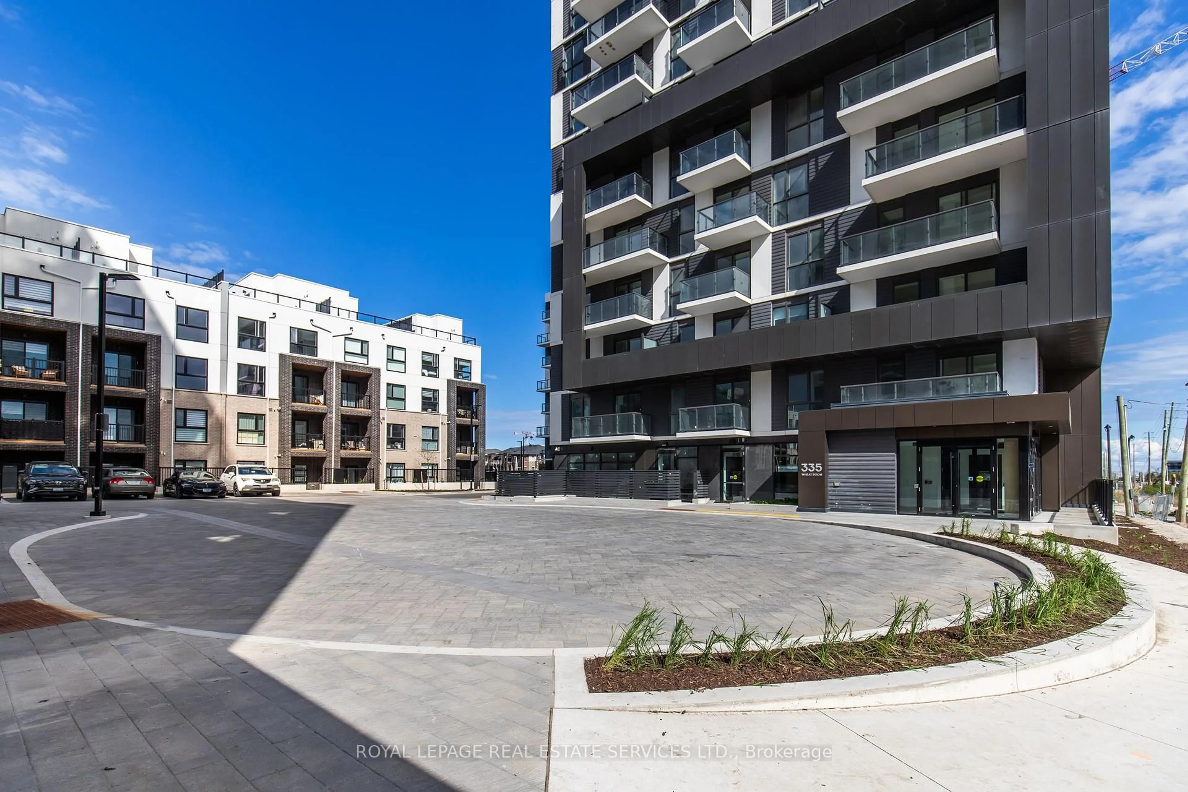 A pic from outside/outdoor area/front of a property/back of a property/a pic from drone, street for 335 Wheat Boom Dr #410, Oakville Ontario L6H 7Y1