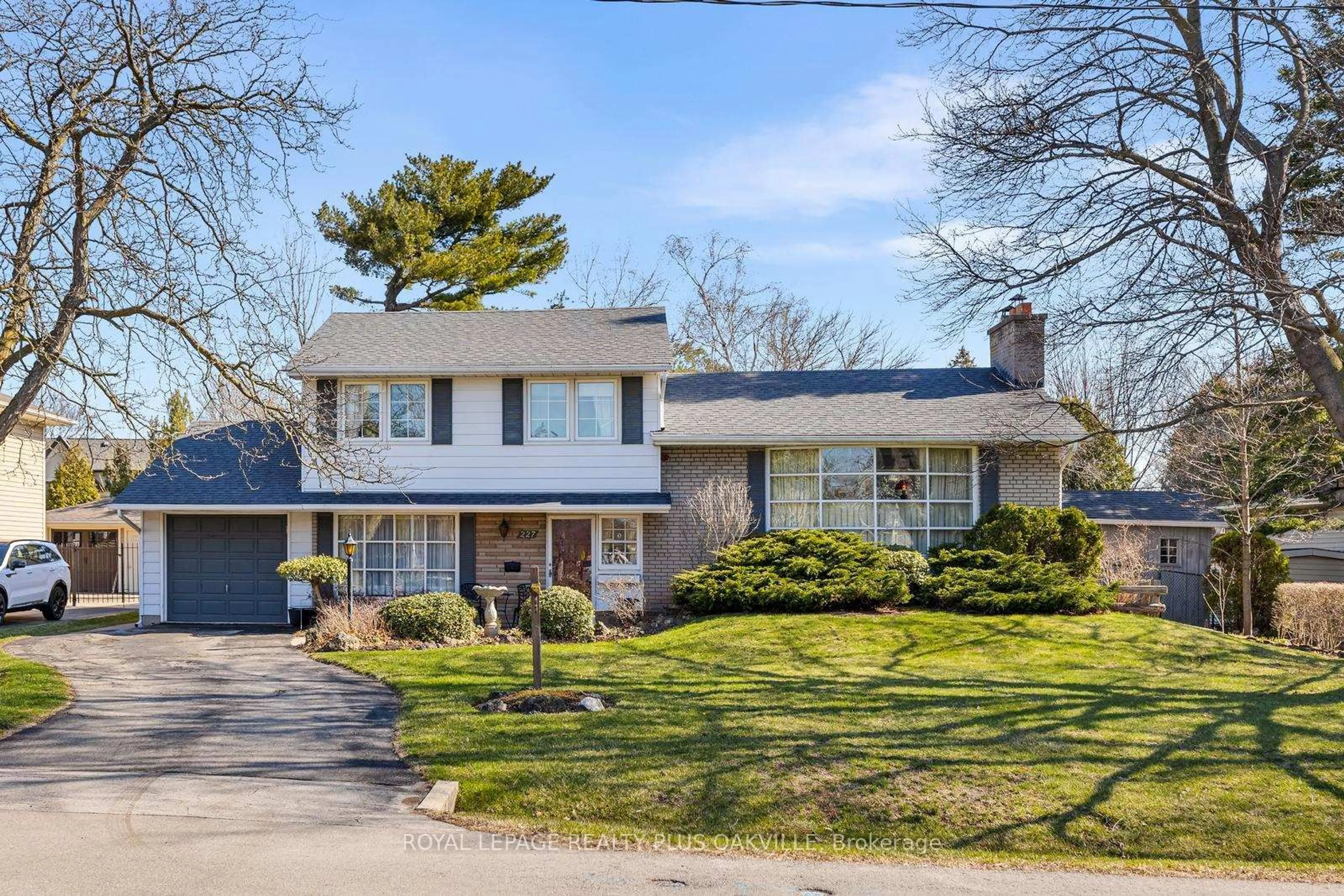 Home with brick exterior material, street for 227 Sandwell Dr, Oakville Ontario L6L 4P3
