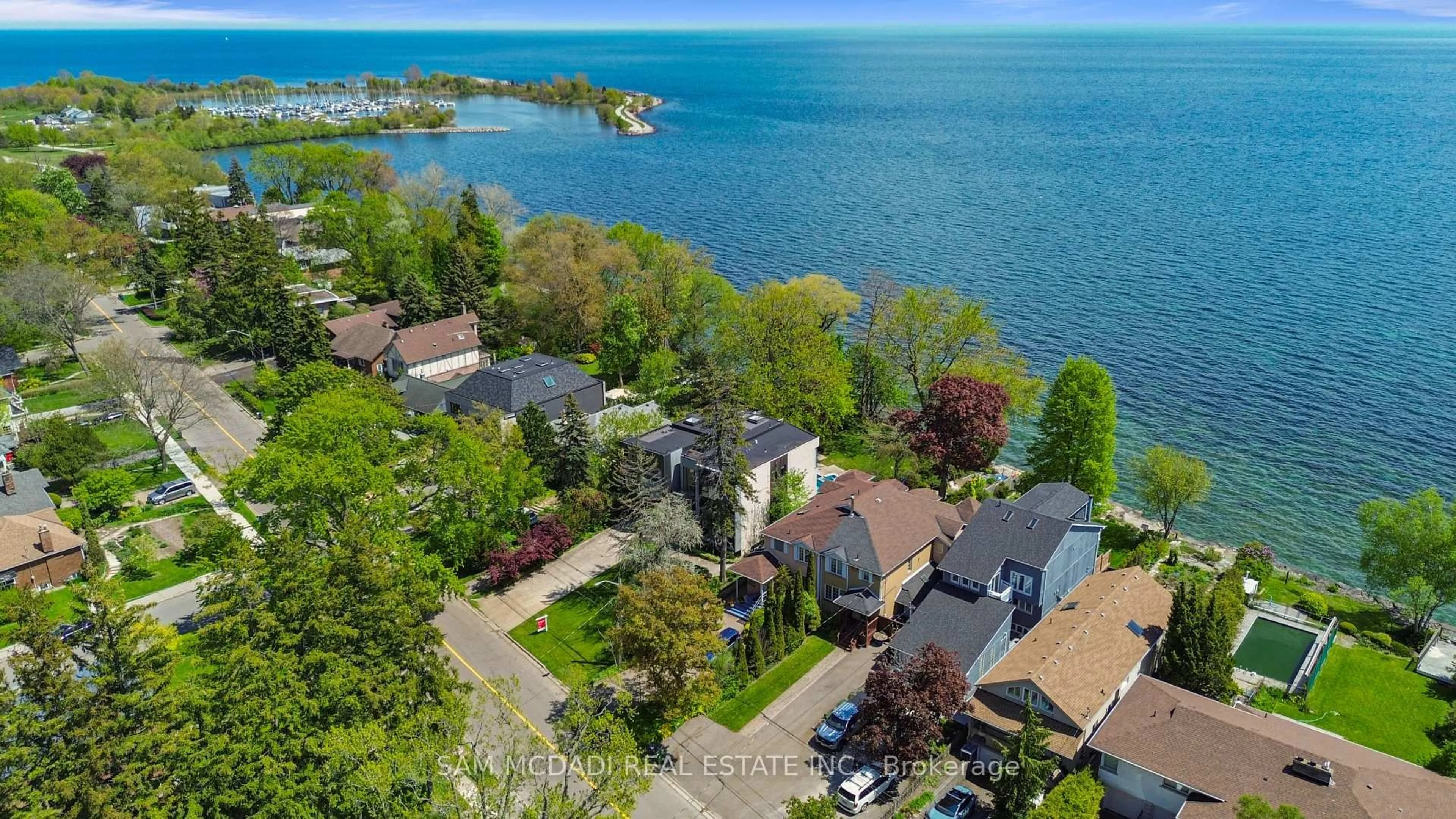 A pic from outside/outdoor area/front of a property/back of a property/a pic from drone, water/lake/river/ocean view for 67 Lake Promenade, Toronto Ontario M8W 1A2