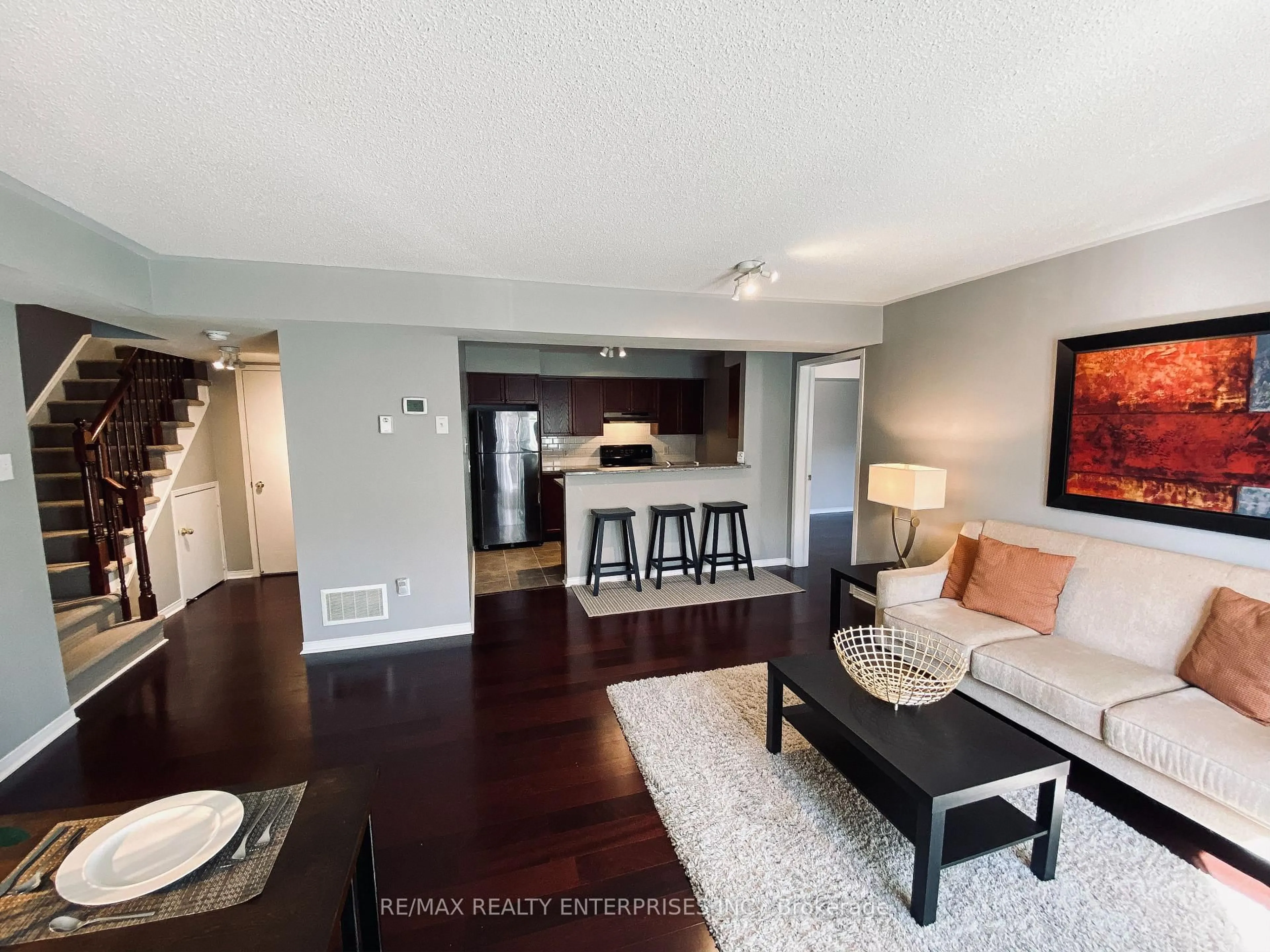 Living room with furniture, wood/laminate floor for 4975 Southampton Dr #145, Mississauga Ontario L5M 8C8