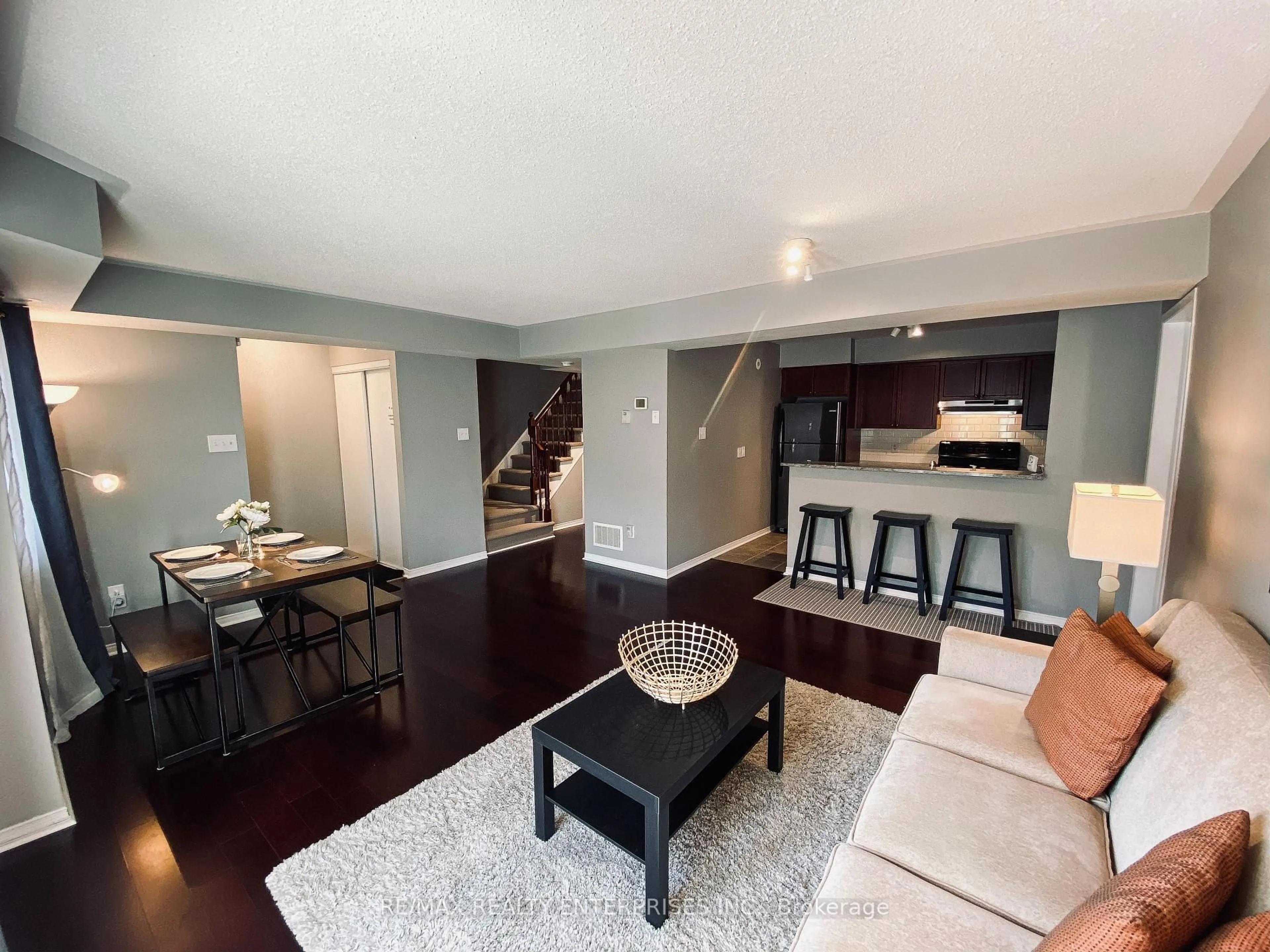 Living room with furniture, wood/laminate floor for 4975 Southampton Dr #145, Mississauga Ontario L5M 8C8