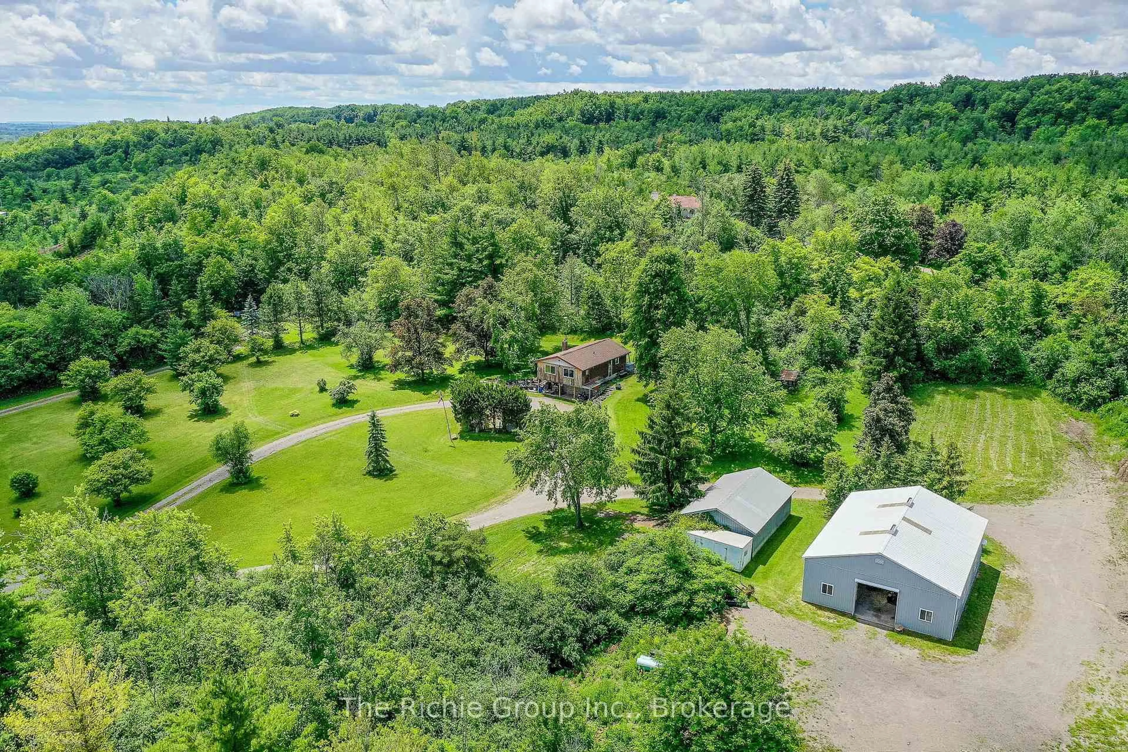 A pic from outside/outdoor area/front of a property/back of a property/a pic from drone, forest/trees view for 13494 Tenth Line, Halton Hills Ontario L7G 4S8