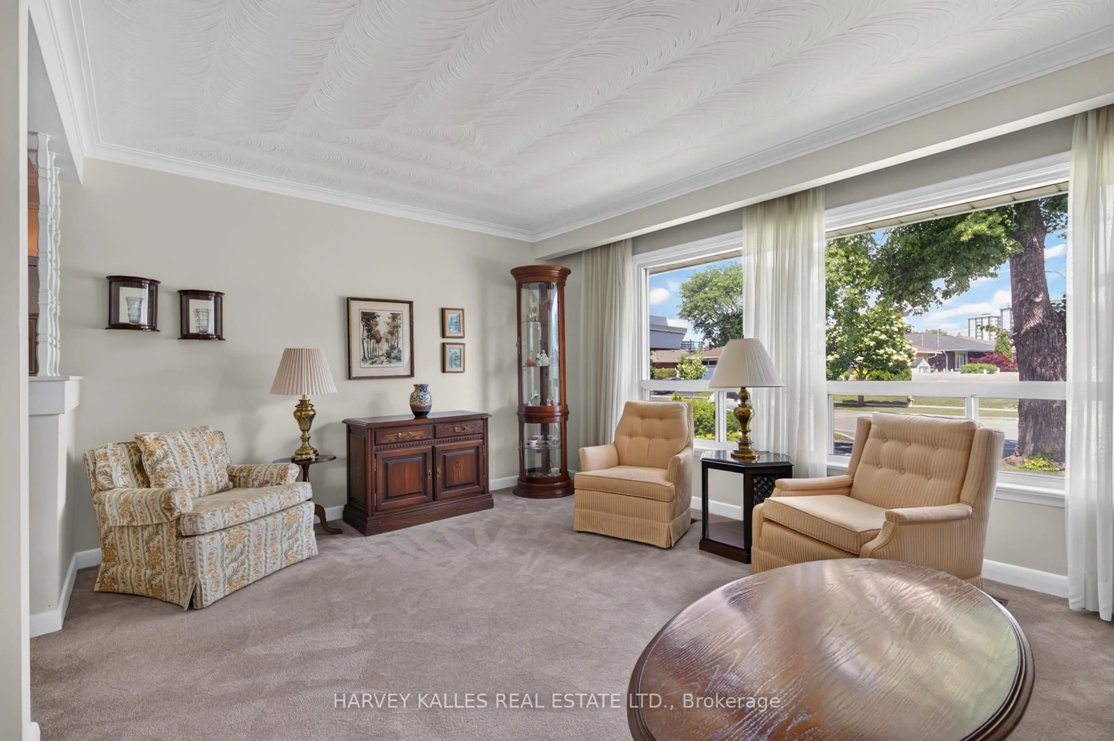 Living room with furniture, carpet floor for 69 Poynter Dr, Toronto Ontario M9R 1L3
