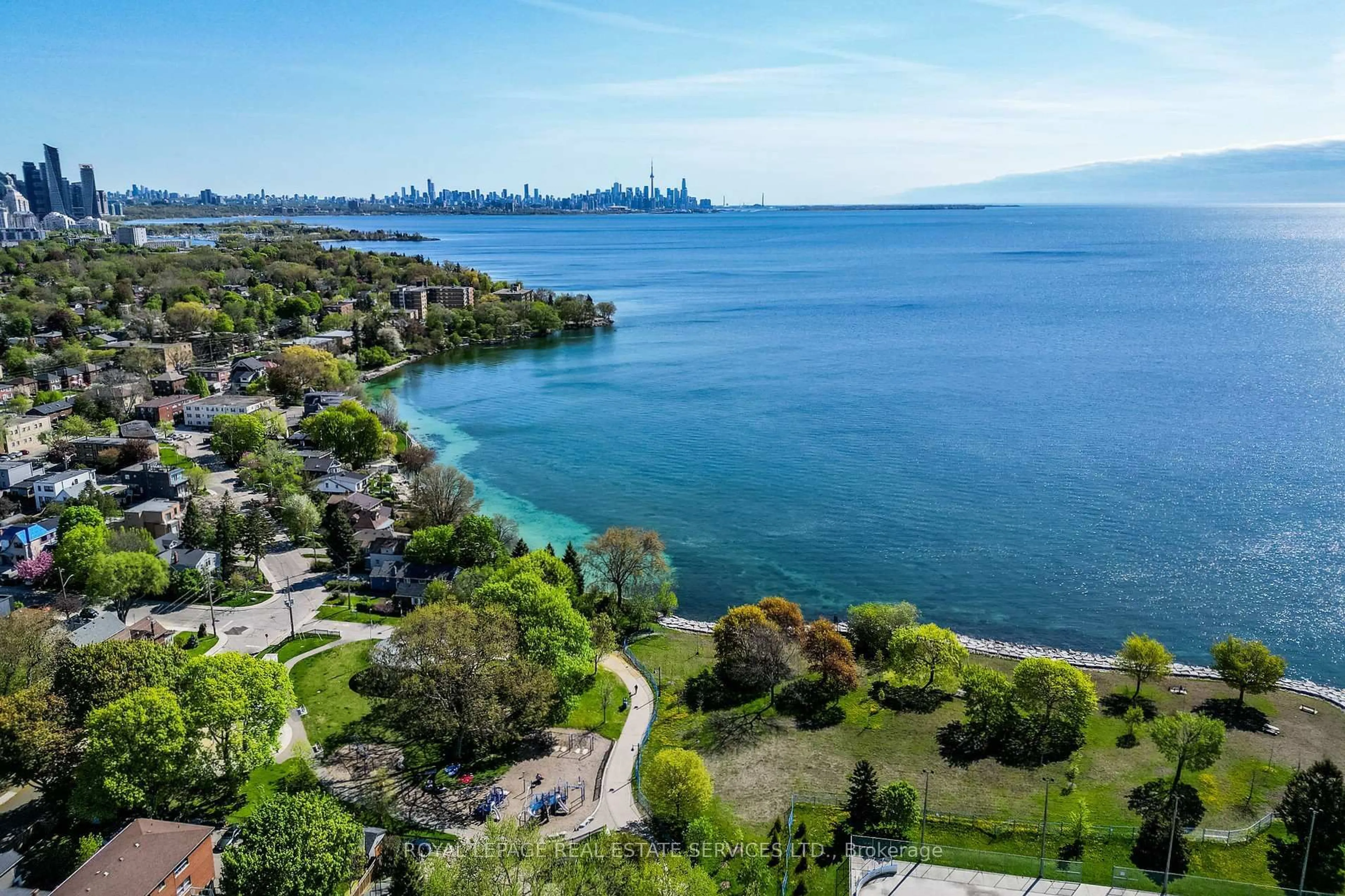 A pic from outside/outdoor area/front of a property/back of a property/a pic from drone, water/lake/river/ocean view for 11A Lake Shore Dr, Toronto Ontario M8V 1Y9