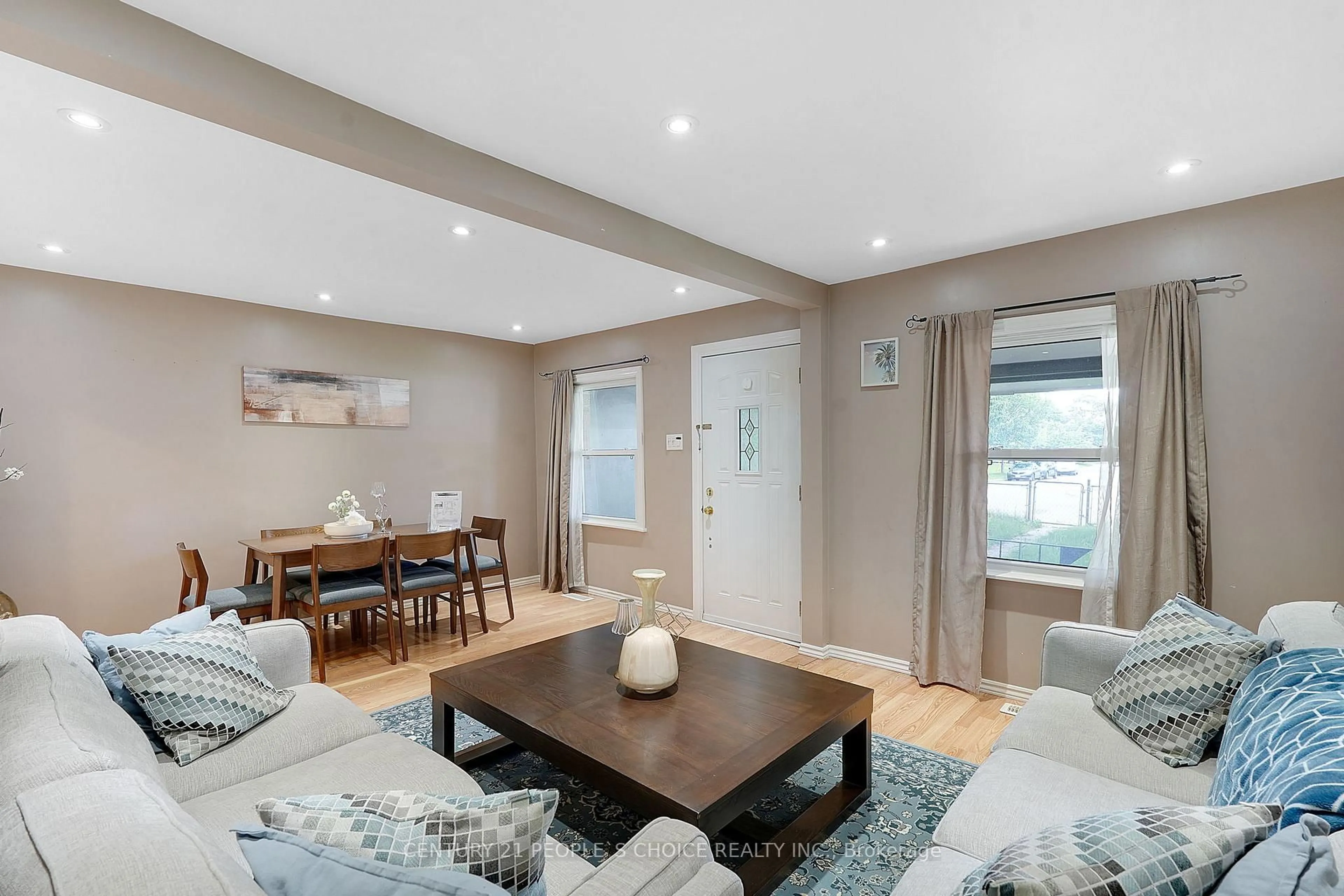 Living room with furniture, wood/laminate floor for 150 Spears St, Toronto Ontario M6N 3X7