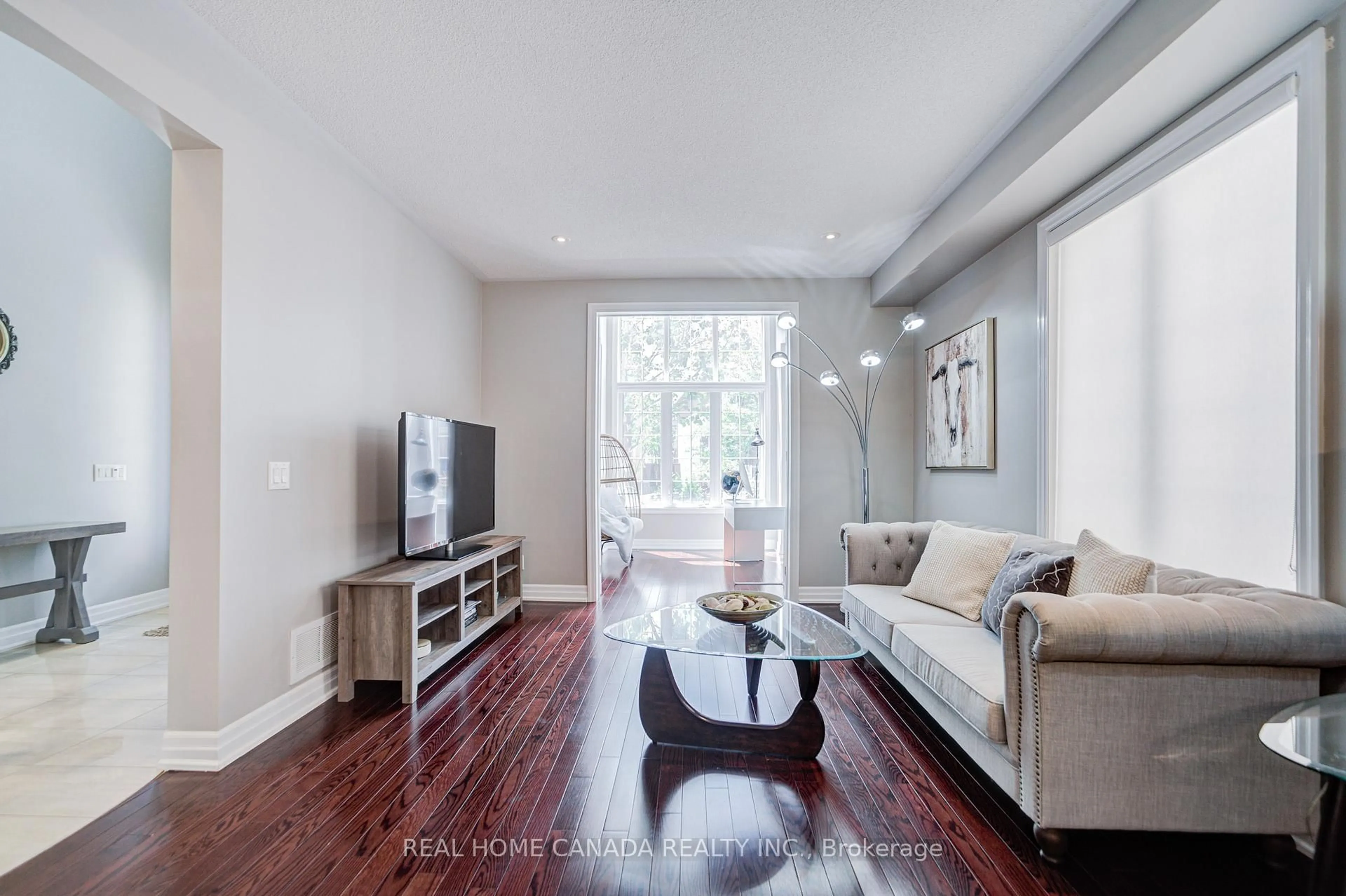 Living room with furniture, wood/laminate floor for 617 Wettlaufer Terr, Milton Ontario L9T 8N1