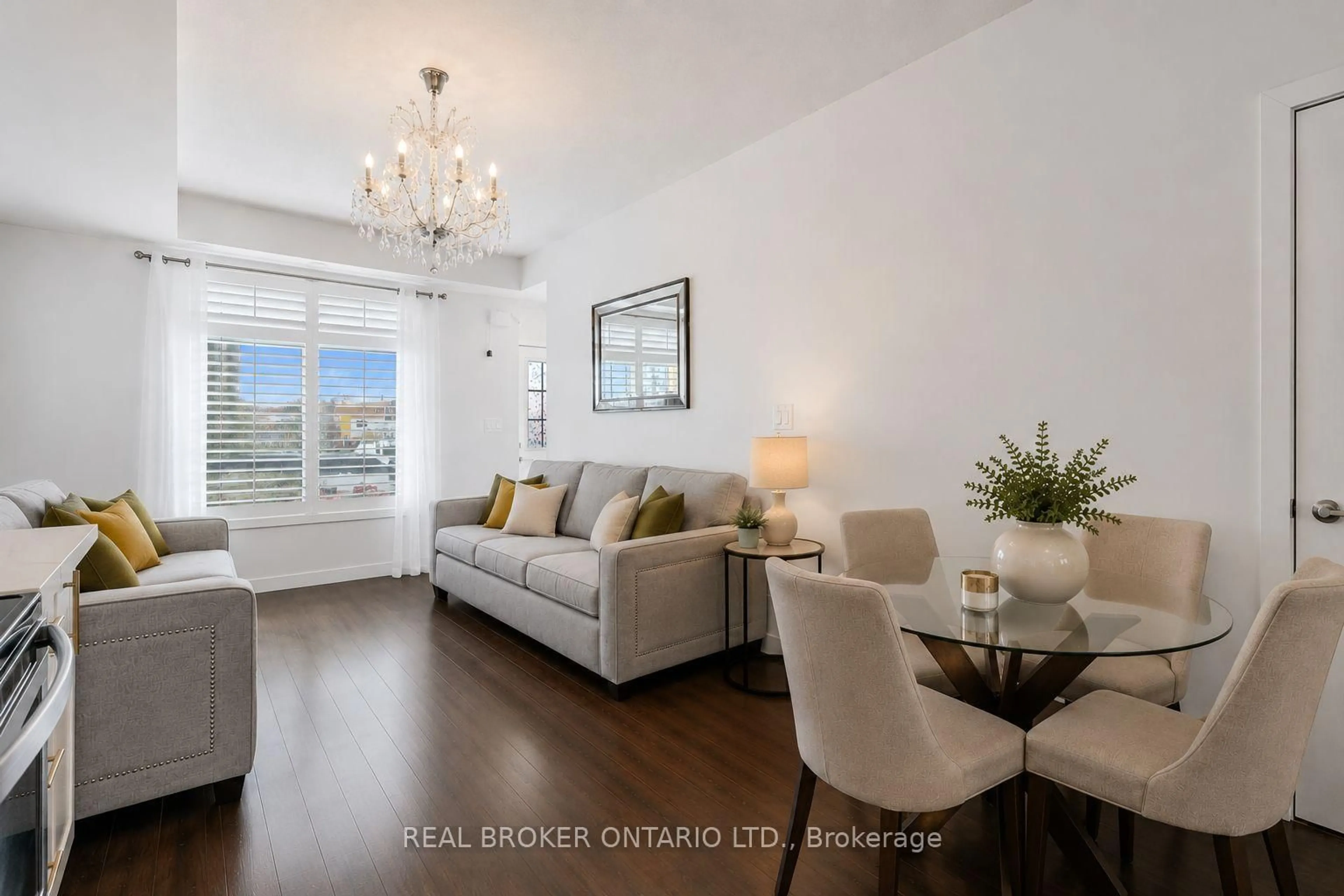 Living room with furniture, wood/laminate floor for 630 Rogers Rd #21, Toronto Ontario M6M 0B4