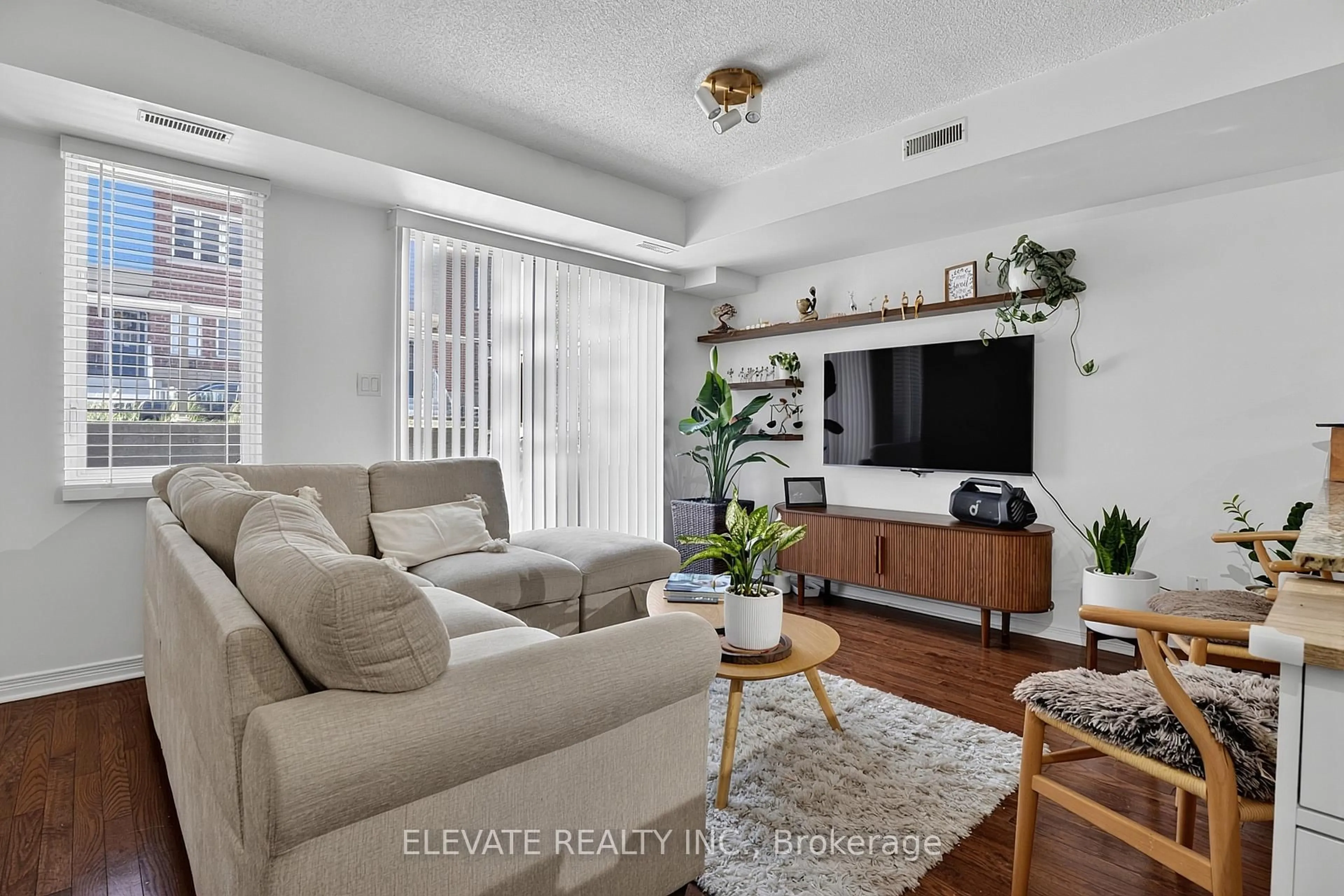 Living room with furniture, unknown for 25 Turntable Cres #141, Toronto Ontario M6H 4L1