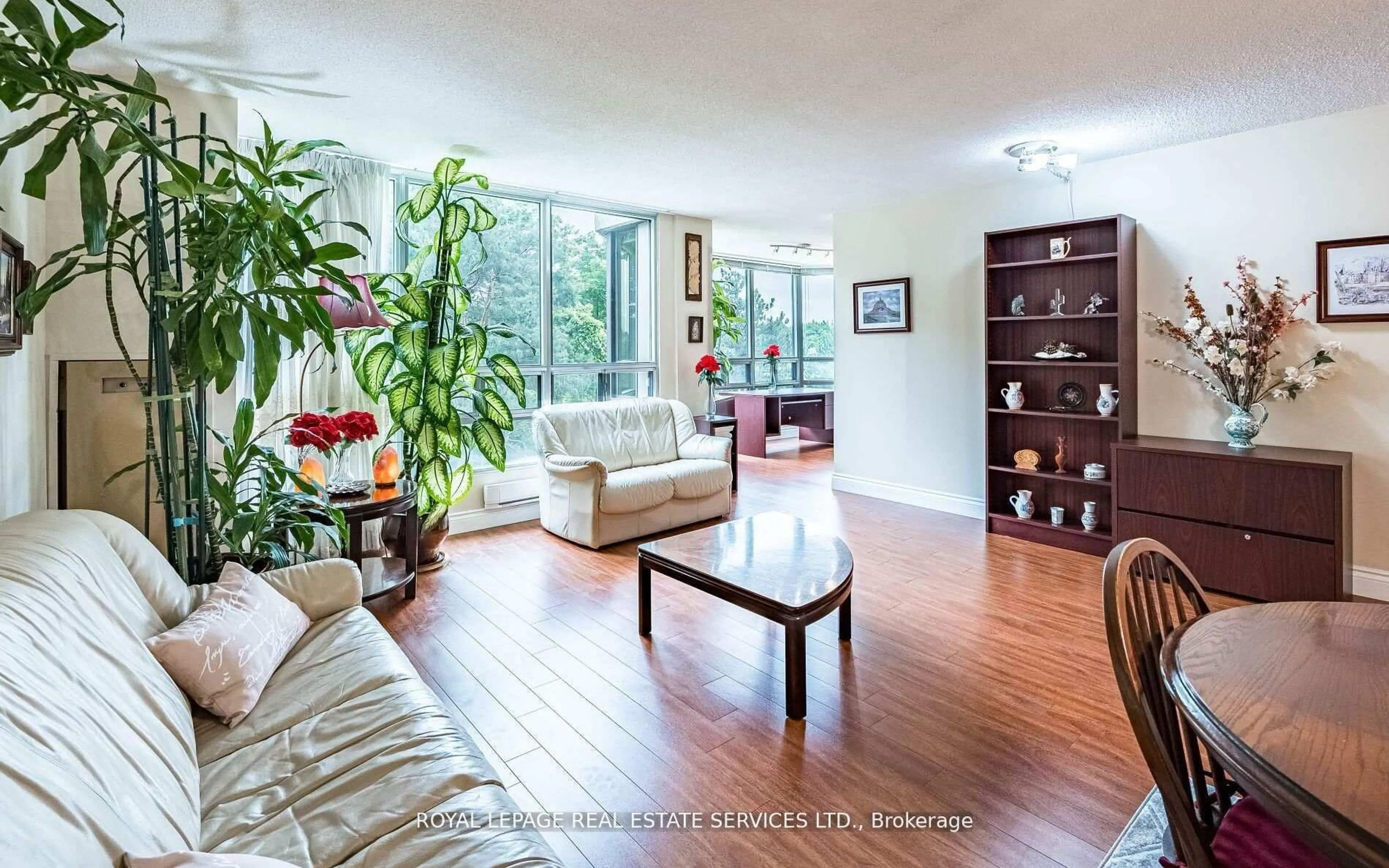 Living room with furniture, wood/laminate floor for 310 Mill St #202, Brampton Ontario L6Y 3B1